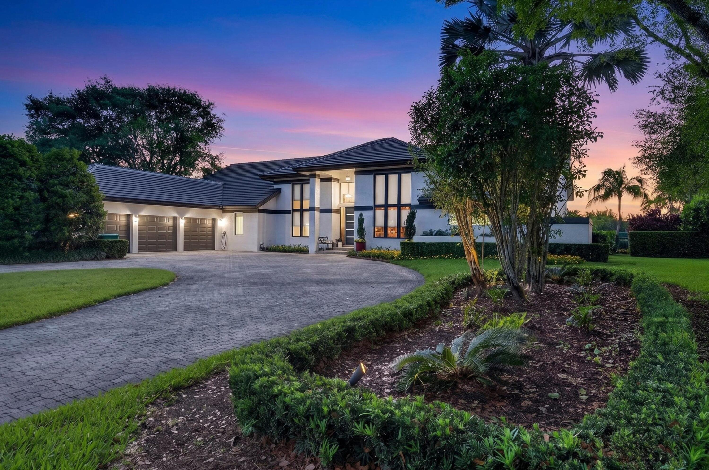 This cul-de-sac, point lot, lakefront .94 acre estate offers breathtaking water views as far as the eye can see! The contemporary design features soaring ceilings, an abundance of windows and 8' sliding glass doors. The open floor plan moves seamlessly between the elegant living room, which features a stunning bar, and the family room, game room (37'x30') and loft (27'x15'). The home boasts five full bedrooms plus an office--the loft and game room can easily be converted to additional bedrooms. Outstanding/desirable features include: triple split floor plan; marble floors; coral, wood burning fireplace; exquisite light fixtures; gorgeous kitchen with granite & stainless steel; new roof 2025; freshly painted 2025; all impact glass; second story wrap-around balcony; stunning, remodeled bathrooms; spacious, covered patio; outdoor custom kitchen; exquisite, oversized pool and spa; beautiful grounds with putting green...all with spectacular water views!