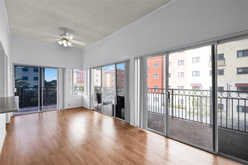Spacious and bright 2-bedroom, 2-bathroom corner unit in the highly desirable Emerald Isles community. This open floor plan features large sliding glass doors in the living area and primary bedroom, bringing in plenty of natural light throughout the home. Enjoy the oversized wraparound balcony, perfect for relaxing or entertaining. The unit offers large bedrooms with walk-in closets, stainless steel appliances, an in-unit washer and dryer, water included, two assigned parking spaces, and elevator access.  Conveniently located just minutes from I-595, the Turnpike, downtown Davie, Seminole Hard Rock, Nova Southeastern University, Broward College, top-rated schools, shopping, restaurants, and hospitals. Quick and easy HOA approval.