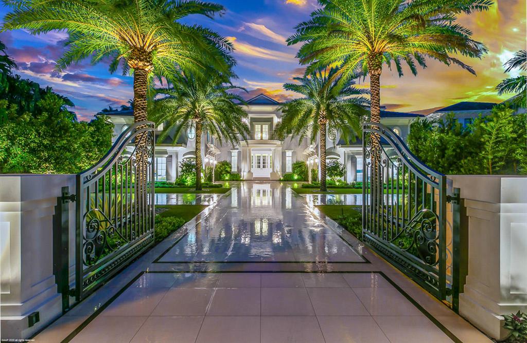 There's this and then there's everything else. If you are satisfied with only the best this show-stopping, custom built, waterfront estate home is for you! Located in the prestigious golf & boating community of Admirals Cove, 377 exemplifies quality, craftsmanship, technology and design at its best. Situated on over 220' of water frontage with views that can't be matched. This home boasts unrivaled hand-picked, modern features and top-of-the-line everything including an unrivaled Officine Gullo custom kitchen imported from Florence (only the 3rd installation of its kind in the US), custom designed Downsview cabinetry throughout the home, 2nd floor golf simulator designed and installed by Trackman, and a real commercial IMAX Dolby Atmos theater with a jaw dropping 25 foot screen! It's sleek and modern finishes combined with the massive Onice Perla with Tobacco Grove inset imported Italian floors accentuate the elegance throughout. This masterpiece was built to enjoy all that the outdoor lifestyle has to offer - featuring an outdoor covered living room sunken in the pool, covered loggia with summer kitchen with cooling misters, resort style infinity salt pool all overlooking the Waterways. The Owners spent countless hours curating everything from outdoor gym overlooking pool,  AC garages to accommodate up to 6 cars, golf cart, motorcycles, tools and storage, his & her separate baths & closets,  VIP guest suite with a private balcony, two outdoor tropical showers,  5 bedrooms, 6 full baths 3 half-baths and 12,675 total SQ FT. If you are looking to live in a home that has it all, then your search is over, this home really breaks new ground in Jupiter!