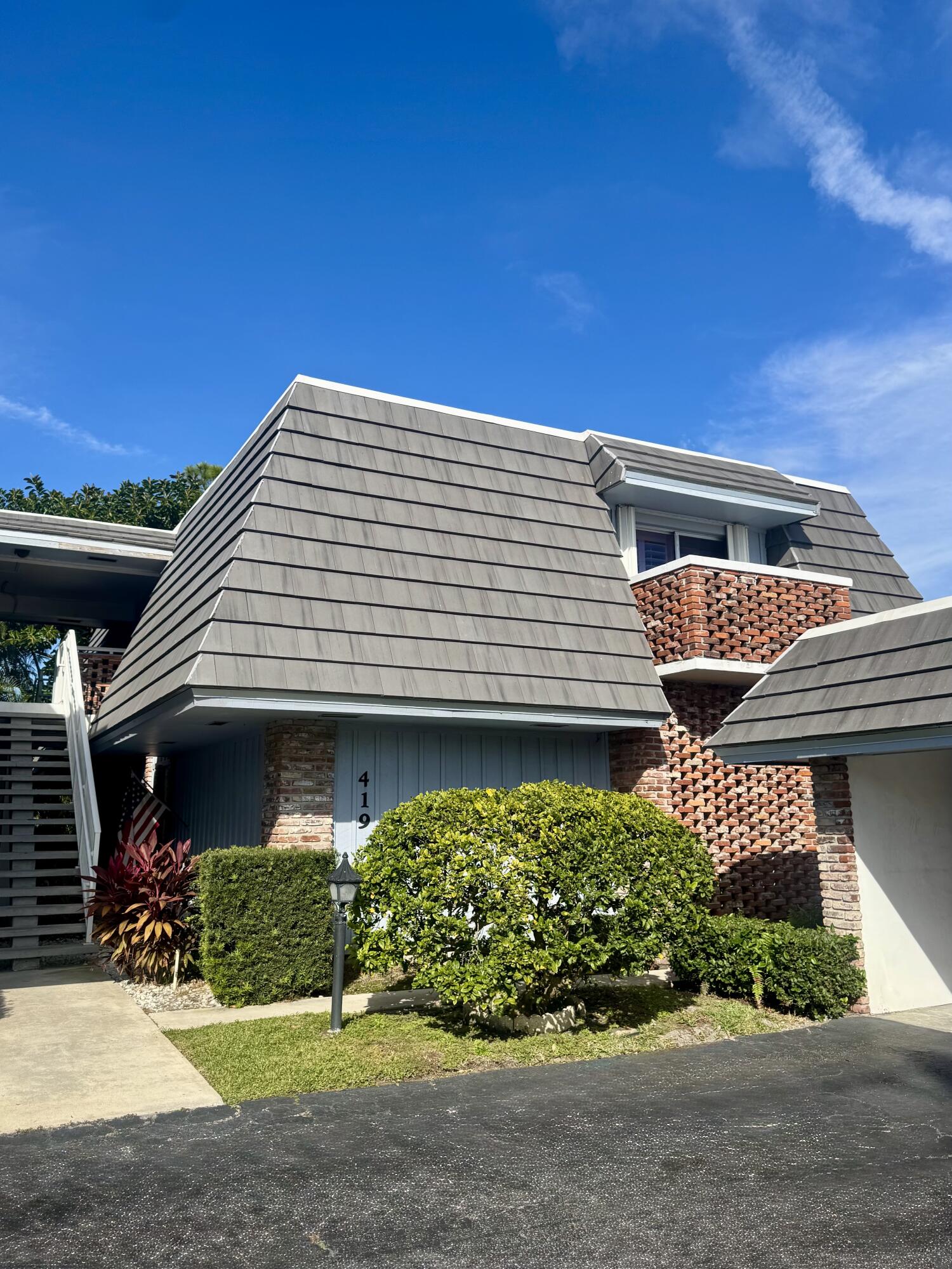 Modern comfort meets tranquility in the heart of Atlantis. This renovated 2BR/2BA condo offers 1,200 sq ft of light-filled living with an open layout connecting kitchen, dining, and living areas in a well-maintained, low-HOA community. The updated kitchen features custom J&K wood cabinetry, 42" uppers, soft-close doors, pull-out drawers, quartz countertops, peninsula seating, new appliances, and added storage. Enjoy peace of mind with impact windows (east side), front/rear shutters, and a new cement tile roof with TPK topper (2025). Relax on a private half-moon balcony with lush views. Additional upgrades include new insulation, LED lighting/fans, fresh paint, and LG washer/dryer. Community pool + gated city with police and two golf courses (membership not mandatory).