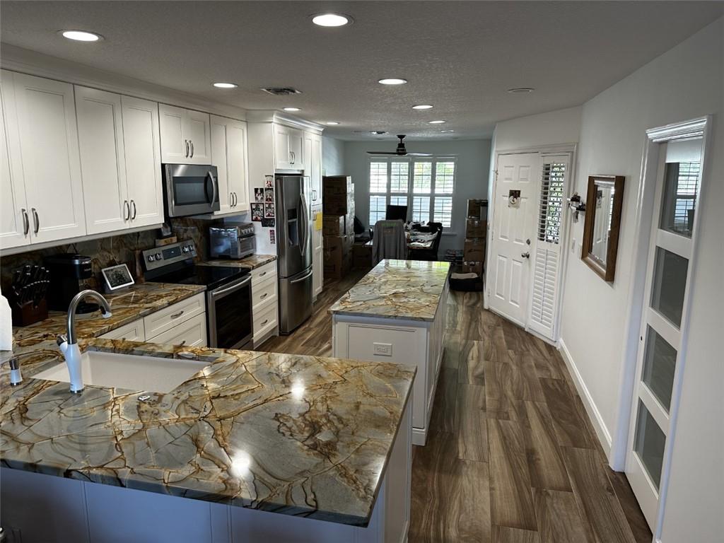 Highly sought after lakeview villa in hidden gem community. This spacious home offers an open floor plan with an updated and extended dream kitchen. This 2-bedroom, 2 bath villa boasts new floors, new bathrooms, 1 car garage, vaulted ceilings, large pantry, no popcorn ceilings and a tremendous screened back patio for entertaining or simply relaxing while enjoying the lake view.  Brentwood of Boca welcomes all ages, is pet friendly and perfectly situated near all shopping, houses of worship and major highways. Don't miss this opportunity to call this Villa your home.