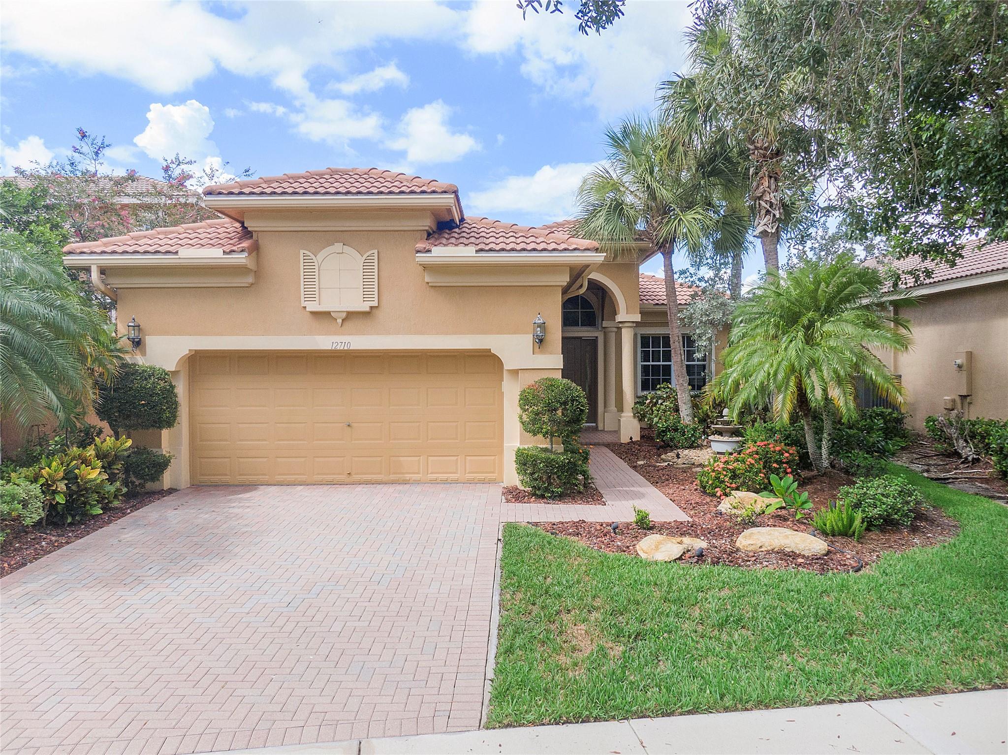 OH YES! Your New Home has come to market. This Beauty is located on a great lakefront cul de sac lot.  The floorplan is multipurpose with the additional formal dining room that easily converts to an office, lounge area or play room. Upgrades include: Kitchen appliances, Newer AC, all hurricane accordions. Large Screened lanai, Plantation shutters, Custom built in office, phenomenal laundry room ++. The owners have maintained this home beautifully. The Landscape is lush & the back yard is ready for entertaining.  Heron Cove includes Lawn & landscape as well as alarm monitoring. Heron bay has 2 beautiful clubhouses, 2 pools, tennis, basketball, playgrounds, half mile markers for walkers and so much more. WELCOME HOME!