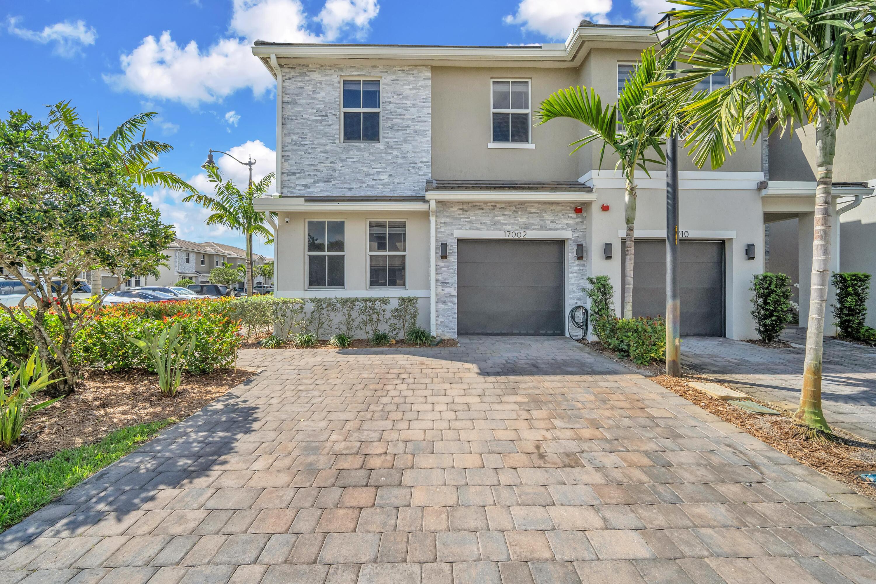 Stunning brand-new corner townhouse filled with natural light! Features 4 bedrooms, 3 full baths, and a 1-car garage with impact windows throughout. Enjoy a convenient first-floor bedroom and full bath—perfect for guests or in-laws. Equipped with smart home features, security alarm, central A/C, and a tankless water heater for efficiency. Built-in fire sprinkler system adds peace of mind.  Located in the beautiful Merrick Square community with low HOA and resort-style amenities including clubhouse, gym, pool, meeting room, and playground. Minutes from shopping, dining, and entertainment. Everything is brand new—Everything is brand new—be the first to call it home! Ask about the $10,000 lender to use towards closing costs. Schedule your showing today!