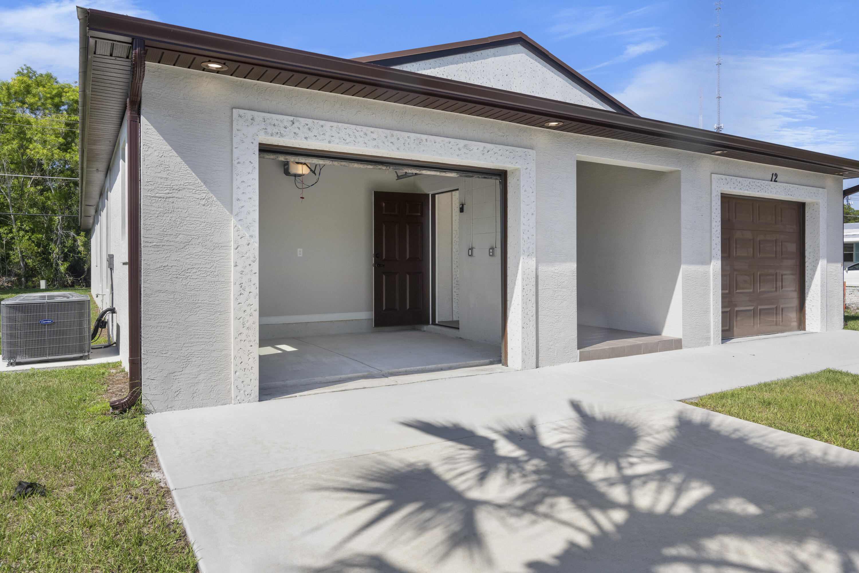 Our most Popular Model: The Windsor offers unmatched value with 3 full bedrooms, 2 baths, and a  car garage + golf-cart garage. Enjoy high vaulted ceilings, a chef's kitchen with a large island, and open concept living perfect for entertaining. Built for comfort and peace of mind with solid block construction and impact windows. Whether you're relaxing at home or enjoying the clubhouse, golf course, or pickleball courts, this home delivers the 55+ lifestyle you've been dreaming of. All models are built with 3/16th true plywood roof sheathing, hurricane tie straps, R-30 insulation, & hip roof designs ensuring big insurance premium discounts. Our homes are equipped with all energy efficient appliances. Land Lease is $799/mo. & includes all amenities, trash service & basic lawn maintenance.
