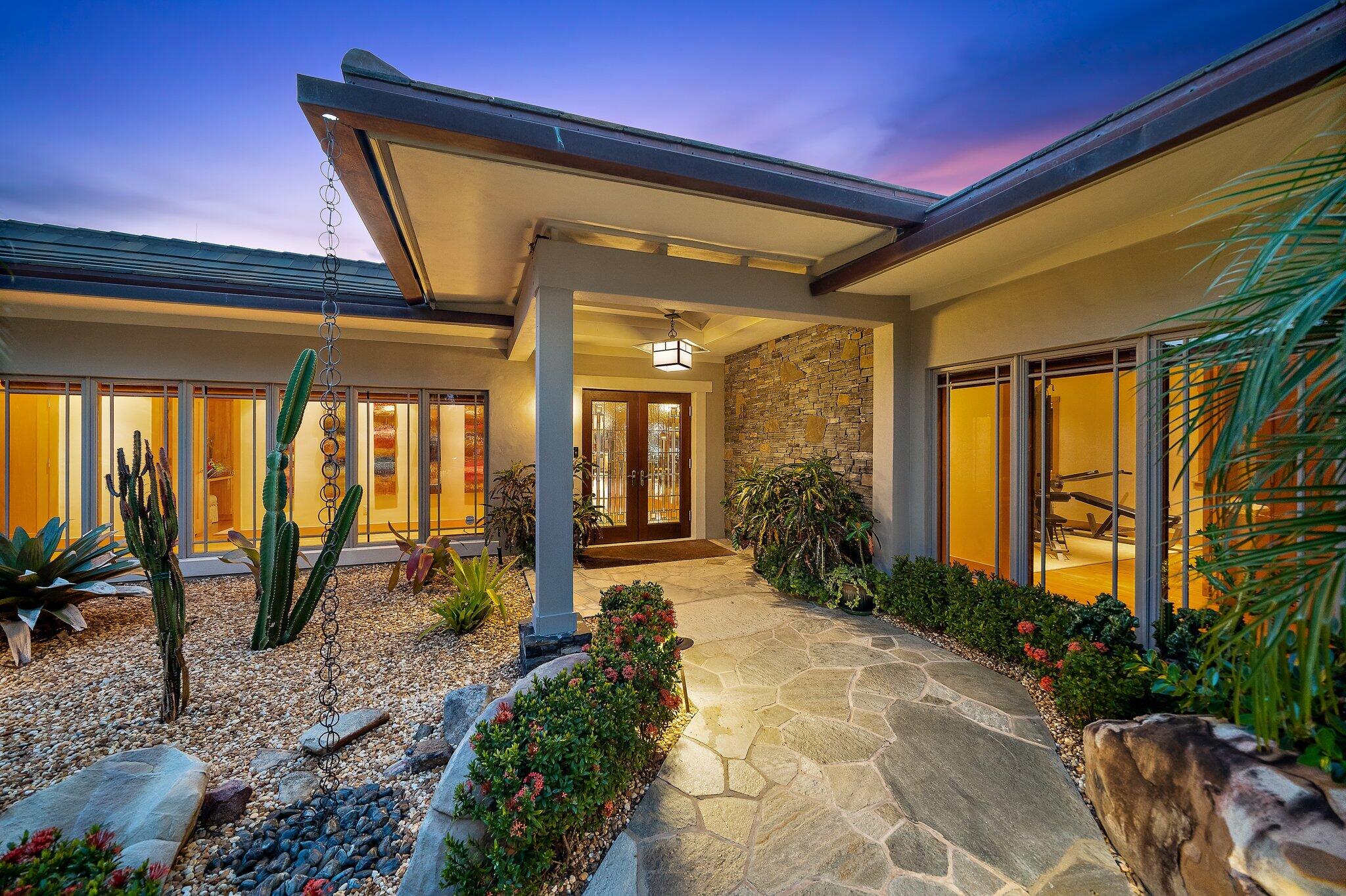 Waterfront retreat in sought after Jupiter Inlet Colony at the southern end of Jupiter Island with 90 ft. of water frontage and a dock with direct Ocean & Intracoastal access in the ''No Wake'' zone. This Oasis features Japanese inspired pool, gardens & grounds (.79 acres) designed by renowned landscape design firm, Kurisu and uniquely paired customized interior/furnishings by award-winning firm, The Weisman Group /San Francisco. Immaculately maintained concrete block 4-bedroom/4-bath home features 5,200 sq ft of living space w an expansive Lanai area that opens up to the free-form waterfall pool and inviting patio w mosquito misting that creates a welcoming environment for enjoying magnificent sunsets. The JIC features Beach Club (membership) and 24-hr police force. Features List attached