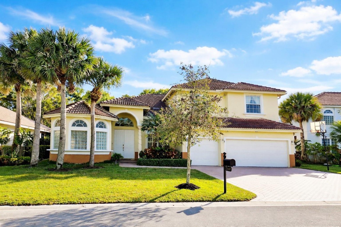 Tucked away in a quiet neighborhood in Coconut Creek overlooking a tranquil lake, this beautiful 5-bed/4-bath home offers privacy and convenience. The open layout leads into the dining and living rooms then flows into the family room under a 22ft ceiling. A bright and spacious atmosphere ideal for everyday living and entertaining. The large Master Suite features his-and-her closets and a bathroom with Jack-and-Jill sinks. The kitchen boasts granite countertops, large island, breakfast bar, and stainless-steel appliances. Upgrades include marble floors on the 1st level, wood floors upstairs, crown molding throughout, plantation shutters, and marble bathrooms. This home is within walking distance of shopping, zoned for excellent schools, and conveniently located near major highways.