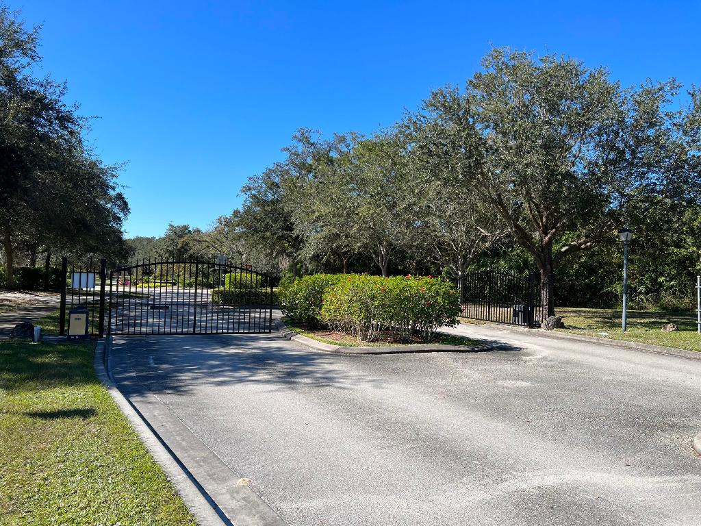 Owner will consider financing to qualified buyer! Magical Village of Kashi gated neighborhood. Rarely available, this tranquil and peaceful lot overlooks a nature pond with hiking trails to the community waterfront boardwalk and fishing pier. Serene is the best way to describe this beautiful corner lot property with surrounding oak trees and sidewalks. Flat, level, and ready to build. County water and sewer.