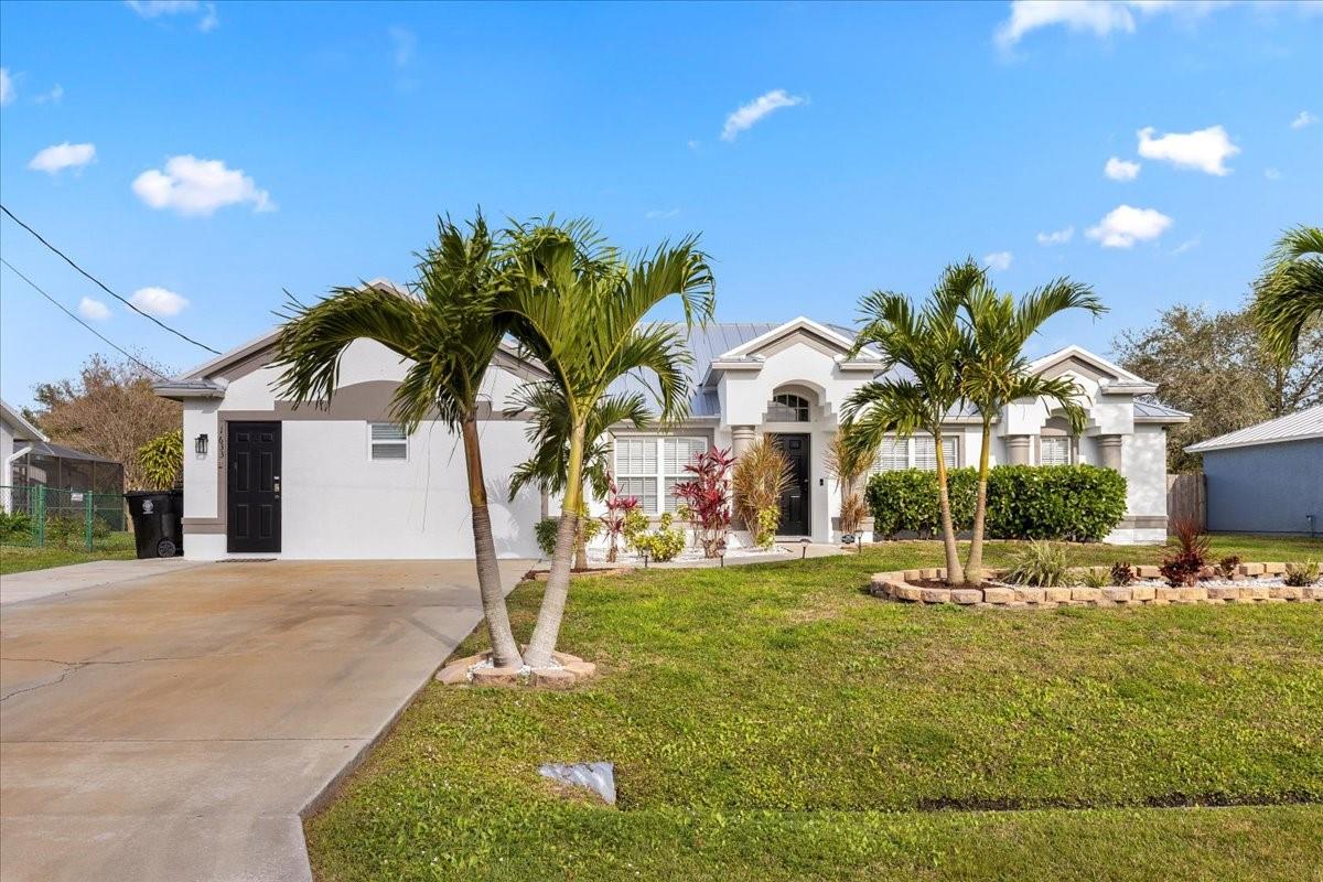 3 Bed/2 Bath home boasting 2386 sqft under air.  Tile floors throughout the residence, with new tile floors in the main living area.  Upgraded kitchen in 2023, with stainless steel appliances, Quartz countertops, and an aesthetic that blends functionality with style.  Updated bathrooms, a complete laundry set, and a screened patio overlooking a vinyl-fenced backyard, featuring a hot tub, fire pit, and a useful shed.  Garage was converted to an In-law suite with separate entrance, installed in 2020, and equipped with an instant hot water tank, makes this property not only a delightful home but also an income-producing gem, with an average of $20k annually over the past three years. A new metal roof in 2023 ensures durability and adds to the overall appeal of this exceptional residence.