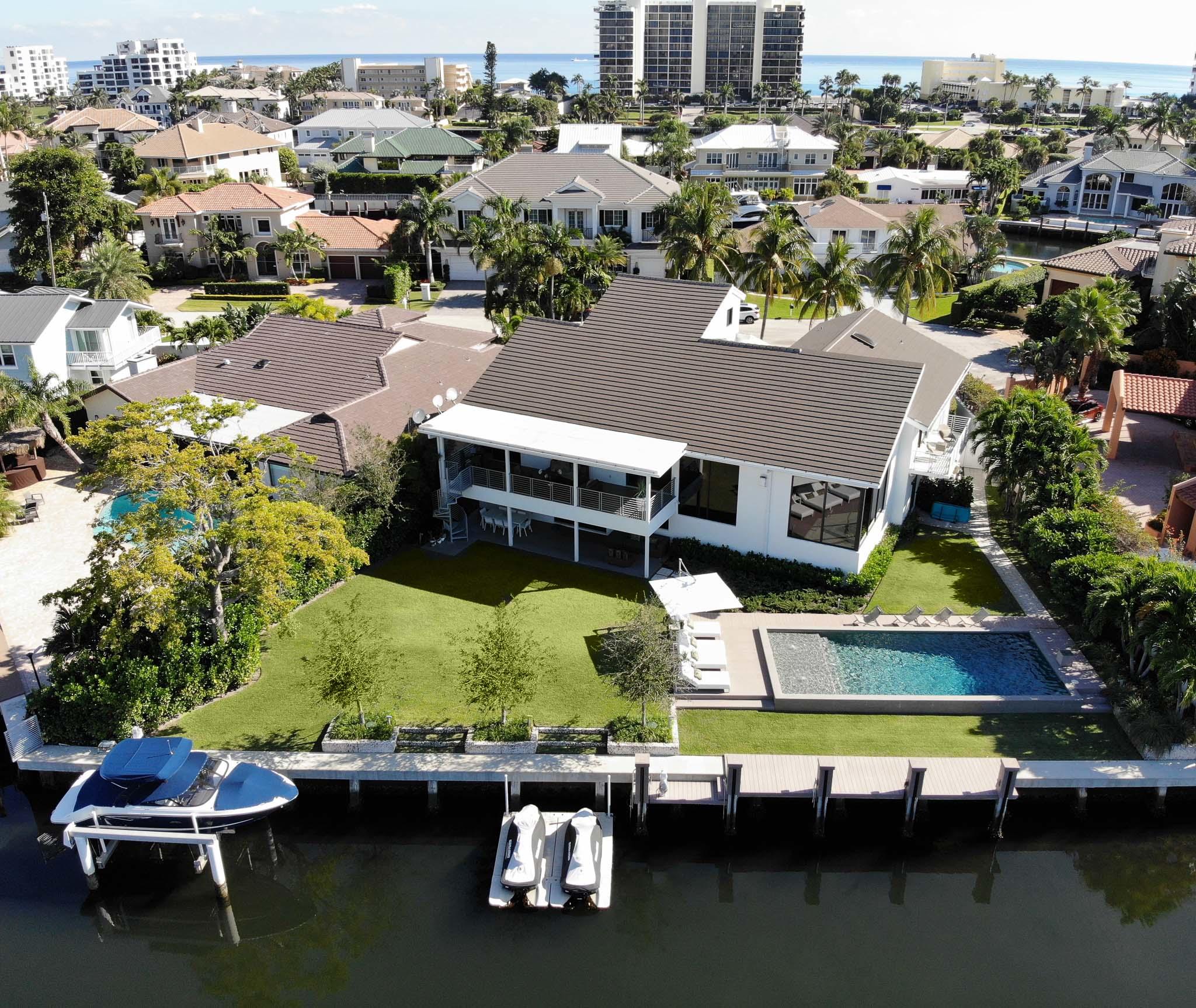 Rare Modern Contemporary deep water front pool home.Situated on a quiet cut de sac on .31 acres, this custom built home is a boaters dream boasting over 130 ft od deep water frontage, seawall, and 25,000 lb boat lift. Full Home Generator. Completely renovated in 2016, no detail or expense has been overlooked. Professionally and totally redesigned. Encompassing 6025 sq. ft. living space, this 5 bedroom, 6 bath home plus home office with open floor plan highlights a modern euro style kitchen with high end features Italian ceramic floors throughout. All bathrooms feature Porcelanosa fixtures. Open and spacious capitalize on all the natural light and beautiful views of the pool area. Volume ceilings and energy efficient impact windows. Spacious Master Bedroom boast a balcony.