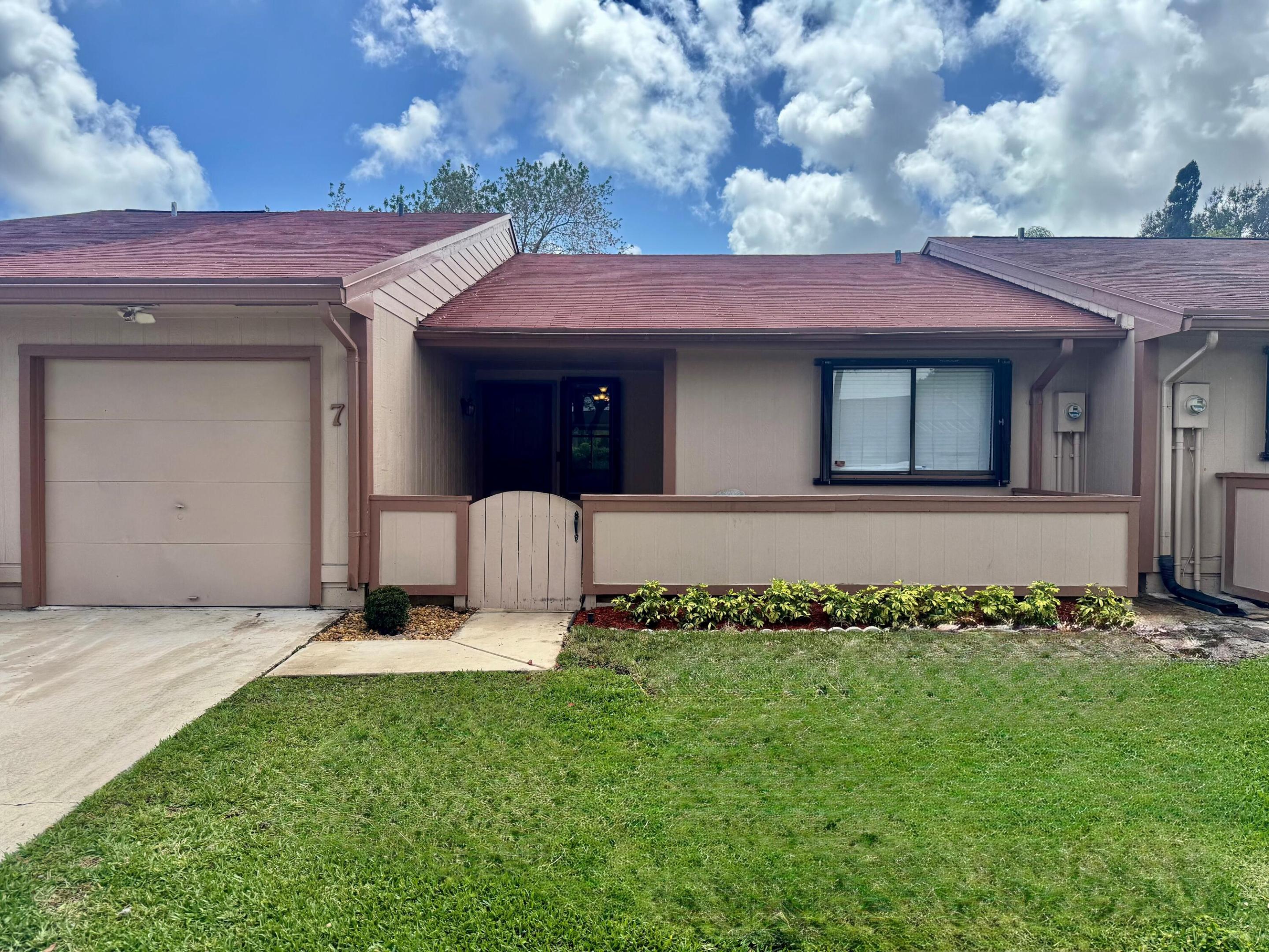 BACK ON THE MARKET...SELLER RENOVATION COMPLETED Welcome Home! Tucked away on a peaceful cul-de-sac in the highly sought-after Boynton Lakes community, this beautifully refreshed 2-bedroom, 2-bath villa is the one you've been waiting for. Every detail has been thoughtfully updated, making this truly move-in ready from the moment you walk through the door. The bright, open interior showcases brand-new luxury vinyl plank flooring, fresh designer paint, beautifully renovated bathrooms, new closet doors, and updated ceiling fans, creating a clean, modern feel throughout. A new roof installed in 2023 provides added peace of mind, while the air-conditioned one-car garage offers the perfect space for parking, a home gym, workshop, or extra storage. Step outside to your enclosed patio overlooking a spacious backyard, with the community pool just steps away—perfect for enjoying the South Florida lifestyle. Best of all, the HOA takes care of the lawn maintenance, allowing you to spend more time enjoying your home and less time maintaining it.  Conveniently located just minutes from shopping, dining, beaches, and major highways, this exceptional home combines style, comfort, convenience, and low-maintenance living. Simply unpack, move in, and start making memories—this is Boynton Lakes living at its finest.