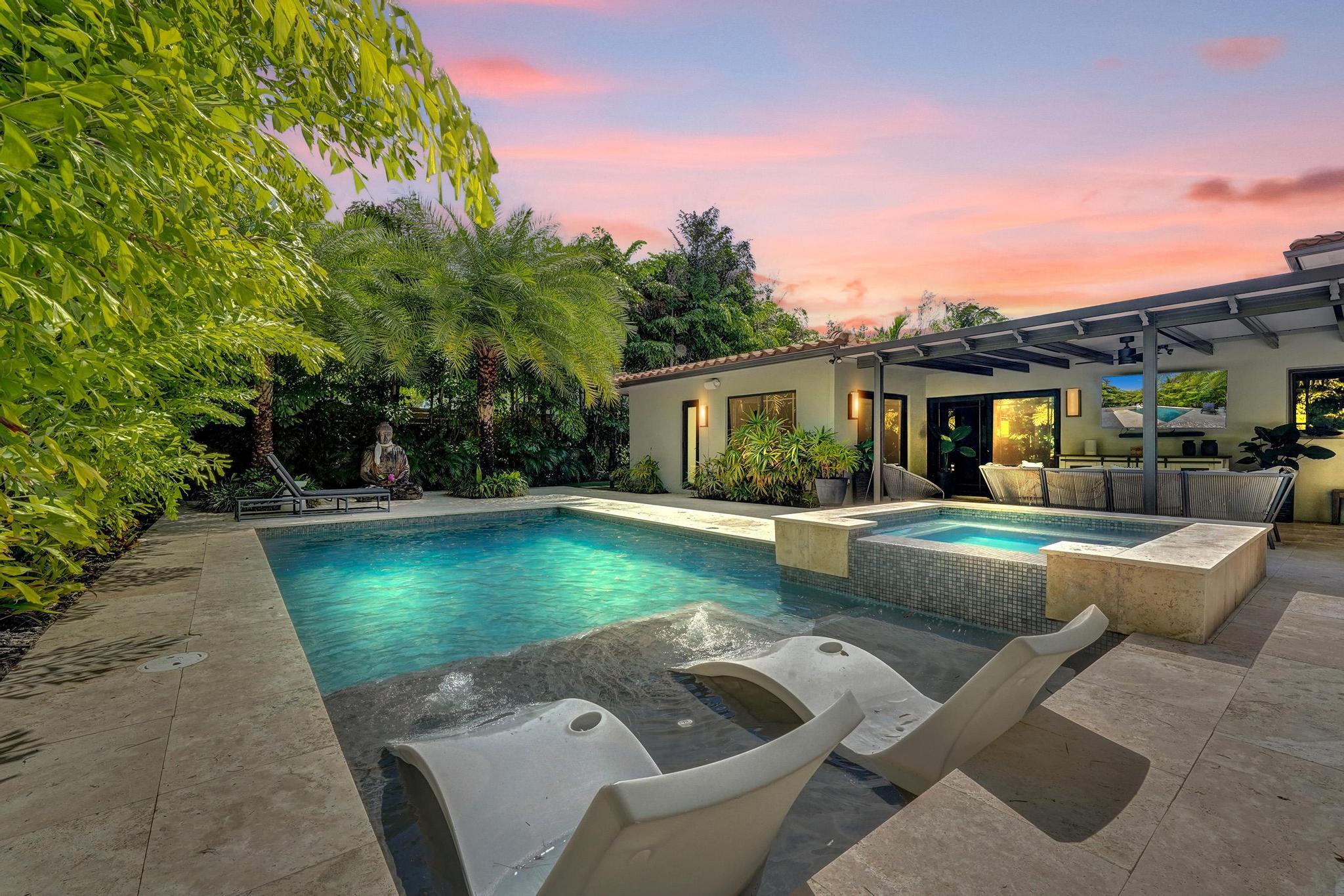 Experience a tue sense of zen in this Coral Ridge home which offers over 3,000 sq ft of living space designed for effortless South Florida living. Enjoy multiple living areas with vast space & volume ceilings, a generous kitchen with oversized breakfast nook & walk-in pantry plus seamless indoor-outdoor flow to an expansive patio and private pool with travertine deck—perfect for entertaining year-round. All rooms are spacious with high ceilings.  This home has been completely re-designed and meticiouslly maintained. Two primary suites plus an additional ensuite bedroom. In addition it offers 4 bedrooms plus a den or office. Only 2 streets north of Bayview Elementary, parks, shopping, dining, and just 1.3 miles to the beach. This home delivers the ultimate Fort Lauderdale lifestyle.