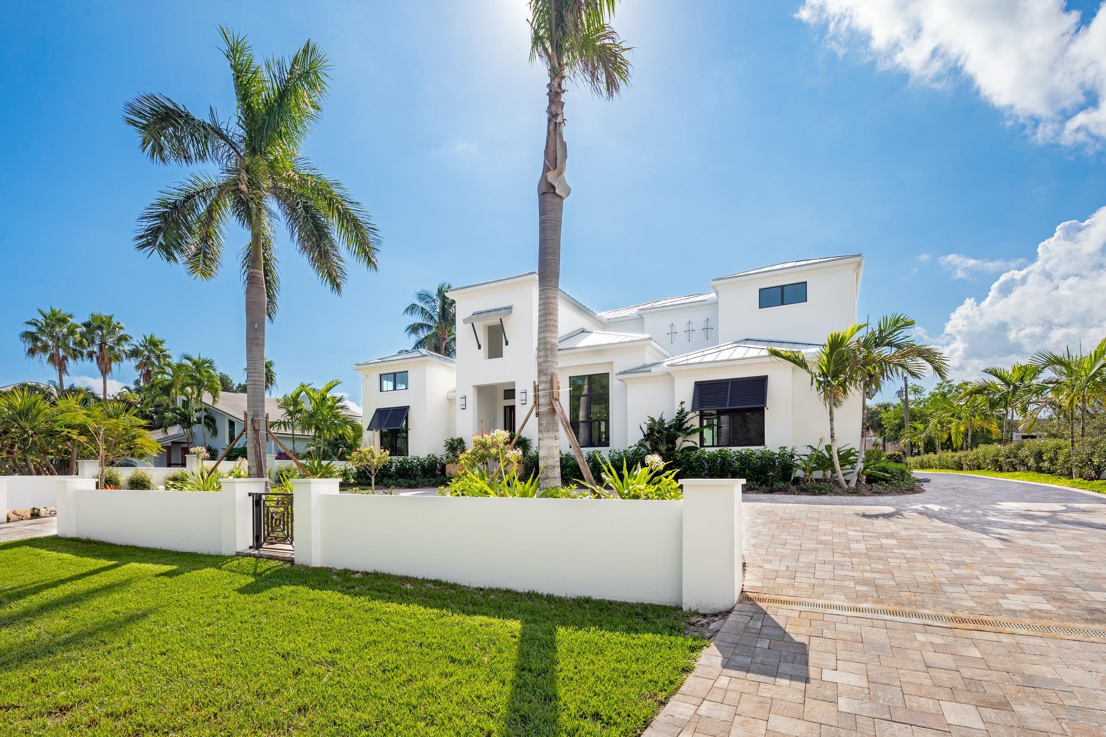 Spectacular New Construction.   This custom designed luxury estate boasts five bedrooms, five and a half baths, a separate guest house, oversized three-car garage, and pool and spa all steps from both the beach and the intracoastal.  
Florida custom home builders Bertino & Associates designed and developed a new masterpiece with no expense spared.  Whether you are entertaining guests or relaxing with the family, this luxury home accommodates any gathering. 

Filled with light, walls of sliders seamlessly allow a true Florida indoor/outdoor living experience.  As you enter through the massive front doorway you are immediately drawn to the great room with its 10ft fireplace, voluminous ceilings and white oak floors that flow throughout the residence.   continued..... The open kitchen is designed with a porcelain waterfall island and every up to date amenity including Thermador appliances and a large pantry. The main level continues with a formal dining room, executive office, climate controlled wine center, VIP guest suite, full laundry room and family entrance with lockers for all that families accumulate. The first floor Master is an oasis of luxury with French doors leading to the garden and pool.  The extraordinary Master Bath is finished with Grohe fixtures (which are also throughout the home) separate vanities, spa tub and enormous steam rain shower. Full size slabs of porcelain and natural stone create a true spa style retreat.

Upstairs there are two spacious en-suite bedrooms and a huge game room/TV room with a bar for entertaining friends or enjoying family time. An expansive veranda overlooks the pool and creates yet another entertaining space.

The thoughtful attention to indoor detail extends to the elegant outdoors. Expansive covered patios encompass the pool and spa.  A thoughtfully designed summer kitchen is conveniently located. Separate from the main house is the three car garage plus spacious storage room. Above the garage is a delightful guest house complete with all the necessities.  19 Hudson Street exemplifies beachside living at its finest. Located in the seaside town of Ocean Ridge, a five minute trip on A1A to Delray Beach, 15 minutes to Palm Beach, and five minutes to two marinas.