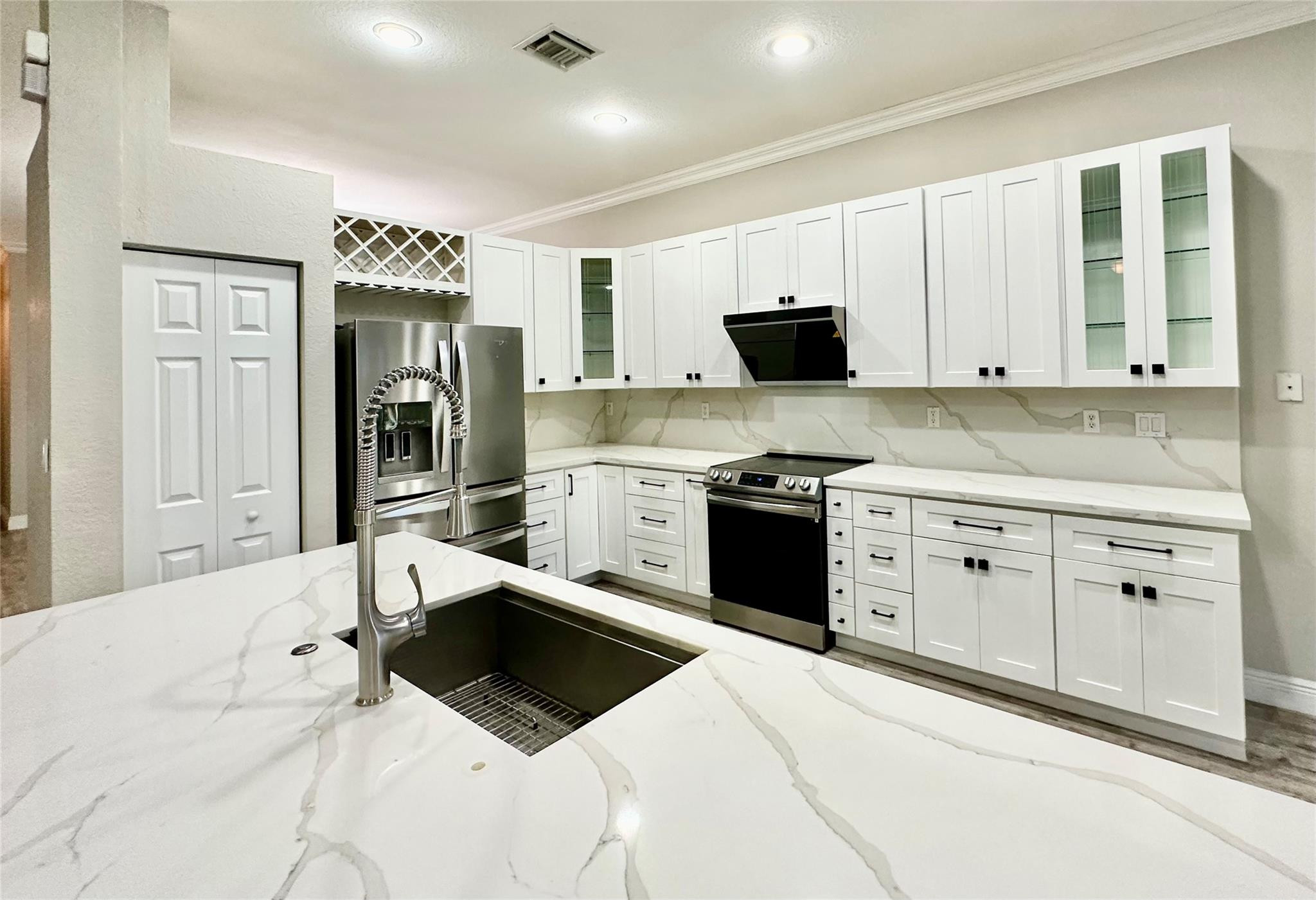 Great Opportunity! Beautifully maintained 1-story, 4-bedroom home in the Prestigious Isles at Weston. Features a Renovated Kitchen with White Quartz Countertops, White Cabinetry, Stainless Steel Appliances (2021), Vented Range Hood, bright Breakfast area, Modern Laminate flooring throughout, Spacious Living room with Plantation shutters, Formal Dining room, & Newer Washer & Dryer (2022). Enjoy a covered Patio, Hurricane Shutters, Rent includes Basic Cable & Wi-Fi. Resort-style amenities include a 24-hour guarded gate, Pool, Fitness center, Clubhouse, & Playground. Great Schools, Cypress Bay High, Falcon Cove Middle, and Manatee Bay Elementary. Conveniently located near Weston Commons, Good Varieties of Shopping, & Dining, and Close to major highways. Quick HOA approval in 1-2 weeks.