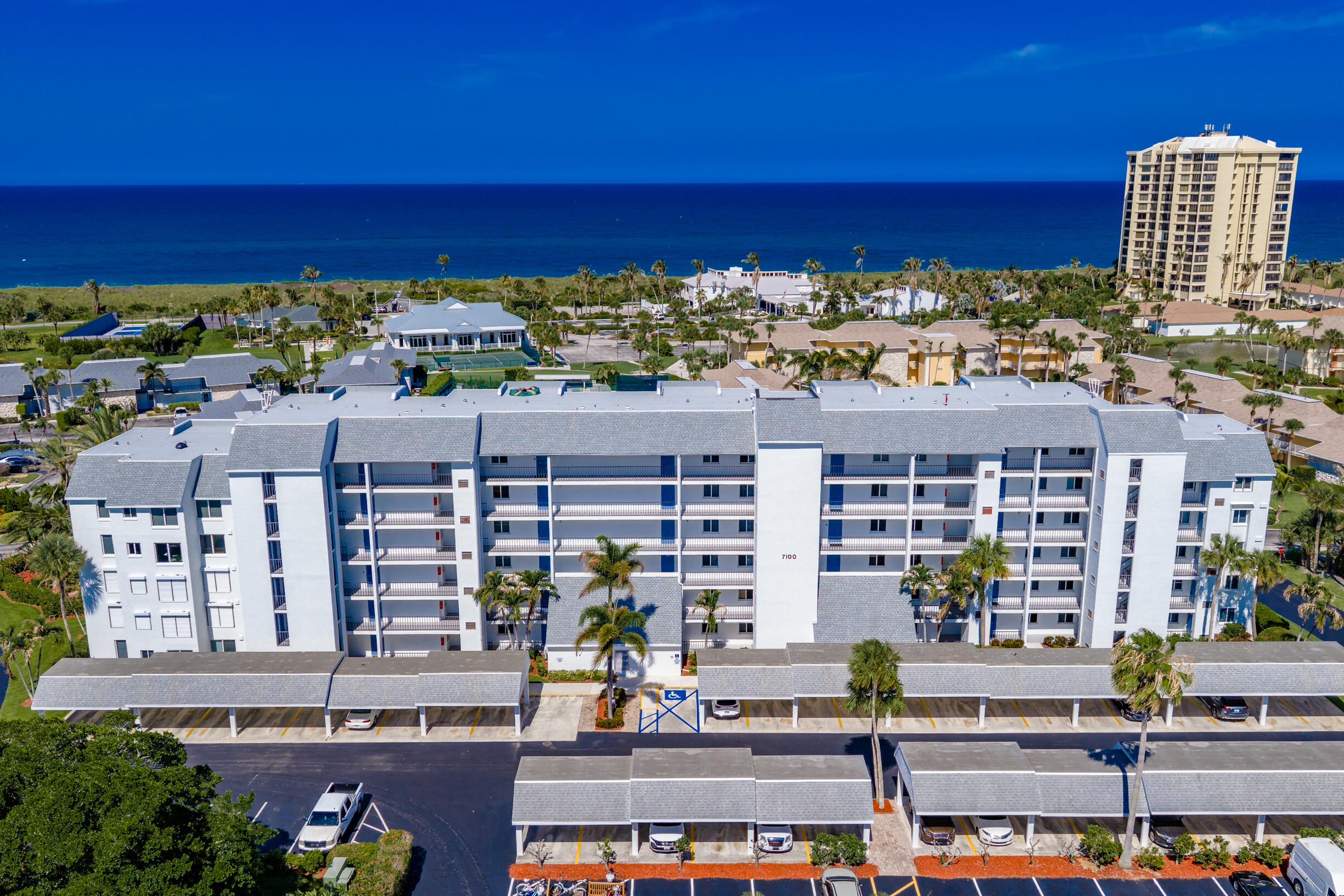 Fully furnished 2BR/2BA condo with golf & tennis court views, crown molding, and open-concept living. In-unit laundry, covered carport & extra storage. Walk to beach, pools, tennis/pickleball & oceanfront dining. New roof, no special assessments, solid rental history. Resort living at its best!