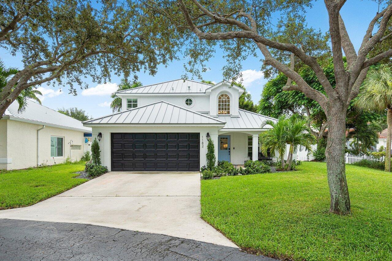Tucked away on a quiet cul-de-sac in the gated community of Delray Lakes, this home offers the kind of space, style, and setting that rarely come together in East Delray. Positioned on nearly a quarter-acre waterfront lot, this property stands out with its expansive yard and prime location. Inside, soaring ceilings and abundant natural light create an open, airy feel from the moment you walk in. The home has been thoughtfully updated with clean, modern finishes, including a redesigned kitchen, refreshed flooring, newer 2021 roof, and impact windows and doors. The layout is both functional and flexible, with a first-floor primary suite and office, plus additional bedrooms and a loft upstairs. See Supplement Remarks. While the backyard has plenty of space to build your dream pool, the heated community pool, tennis/pickleball courts, and amenities are just a few steps from your front door. The community also features a private boat storage area and ramp leading directly to Lake Ida. Live only minutes from Atlantic Avenue, where dining, shopping, nightlife, and the beach come together to define the Delray lifestyle.