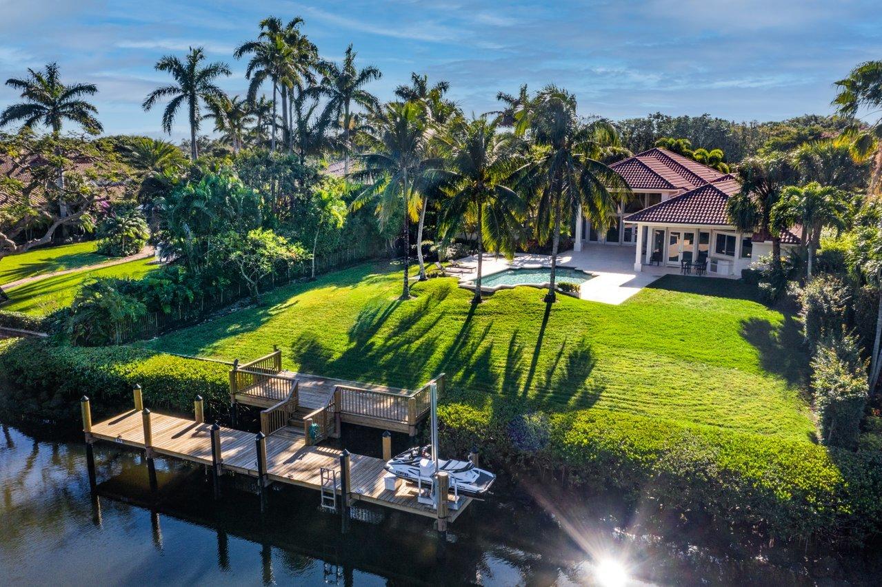 Sought after deep water custom built home situated on a lush oversized lot in sought after Frenchmans Creek!  Dock was newly built in 2020 for your 60ft boat and offers a lift perfect for your jetski.  The custom pool and spa is the perfect place to relax in the South Florida sunshine. This spectacular home boasts 4 bedrooms, 5.5 baths, and a private office/den with custom built-ins.  As you enter the bright entryway, the Saturnia stone floors lead you to the relaxing pool/water views. The well appointed Main Suite offers an additional sitting room, perfect for your Peloton or a relaxing oasis. The light and bright Main Suite bathroom boasts a stunning soaking tub with tropical views. The spacious additional bedrooms with built-in closets are perfect for guests.