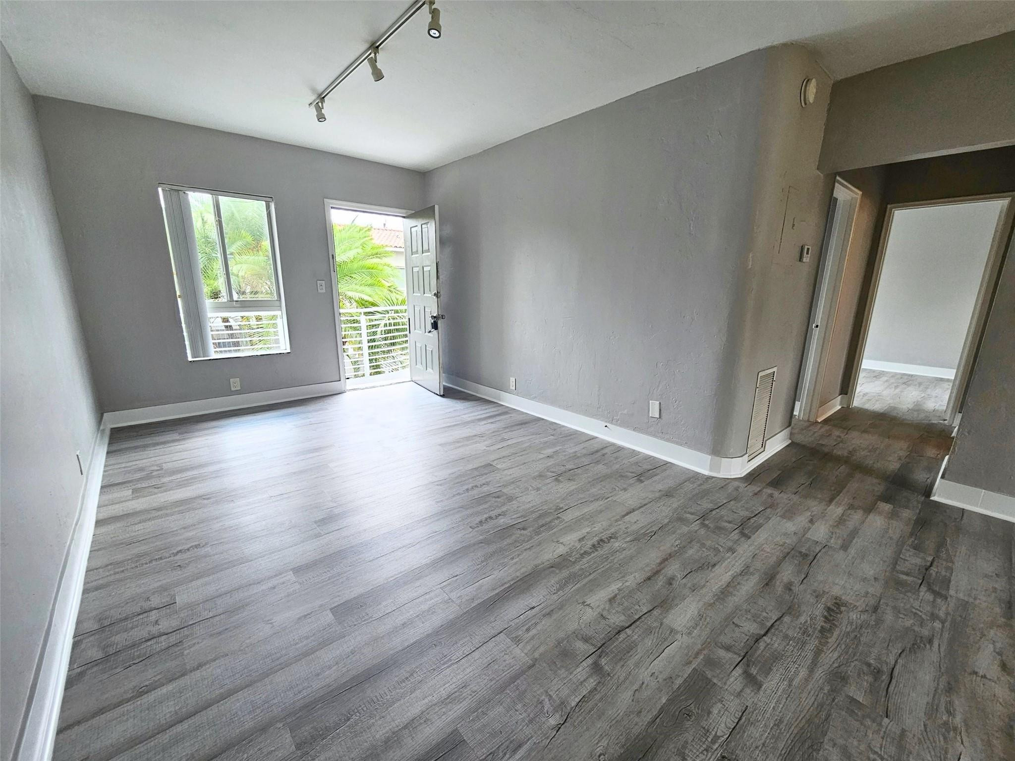 EASY SHOWINGS | FAST APPROVAL | PET-FRIENDLY - 1 Bed / 1 Bath - Second floor corner - Take a quick look at everything this unit has to offer.  UNIT FEATURES: - Top Feature: Garden-style second-floor unit with a massive living/dining space, vinyl floors, pantry, extra storage, and a private or shared balcony. - Laundry Facilities: On-site coin-operated laundry. - Air Conditioning: Central A/C. - Parking: Assigned parking space included.  LOCATION - Centrally located between downtown Fort Lauderdale and the beach - Minutes from Las Olas, Flagler Village, and Wilton Manors nightlife - Easy access to I-95 for commuting - Close to parks, shopping, and top dining spots - Perfect for professionals who want convenience + lifestyle, Holiday Park, and E Sunrise Blvd  MOVE-IN COSTS: - First month's r