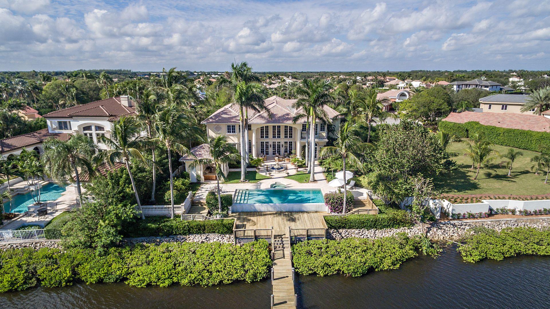 DRASTICALLY REDUCED BY $1.5 MILLION.
BEST DEAL IN ADMIRALS COVE!
10 Bedroom, 8 full & 2 half bath custom estate with exquisite details throughout. This 10,000 square foot estate has soaring 15' to 24' ceilings in the living areas, marble and wood floors, antiqued mirror panels in foyer and dining room, crown molding and hand painted wall finishes. Mexican shell stone columns & trim inside and out. The formal living room has a stone fireplace, walnut floor and tiled bar with sink, refrigerator and ice maker. Dining Room has 15' corbelled celling and stone crafter columns. Gourmet kitchen has all of the bells and whistles including an oversized island, SubZero refrigerator, Thermador 6 burner range with grill and 2 Bosch dishwashers. Custom built-ins in library and office. Master suite has sitting area, his & her walk-in closets with private exercise room.