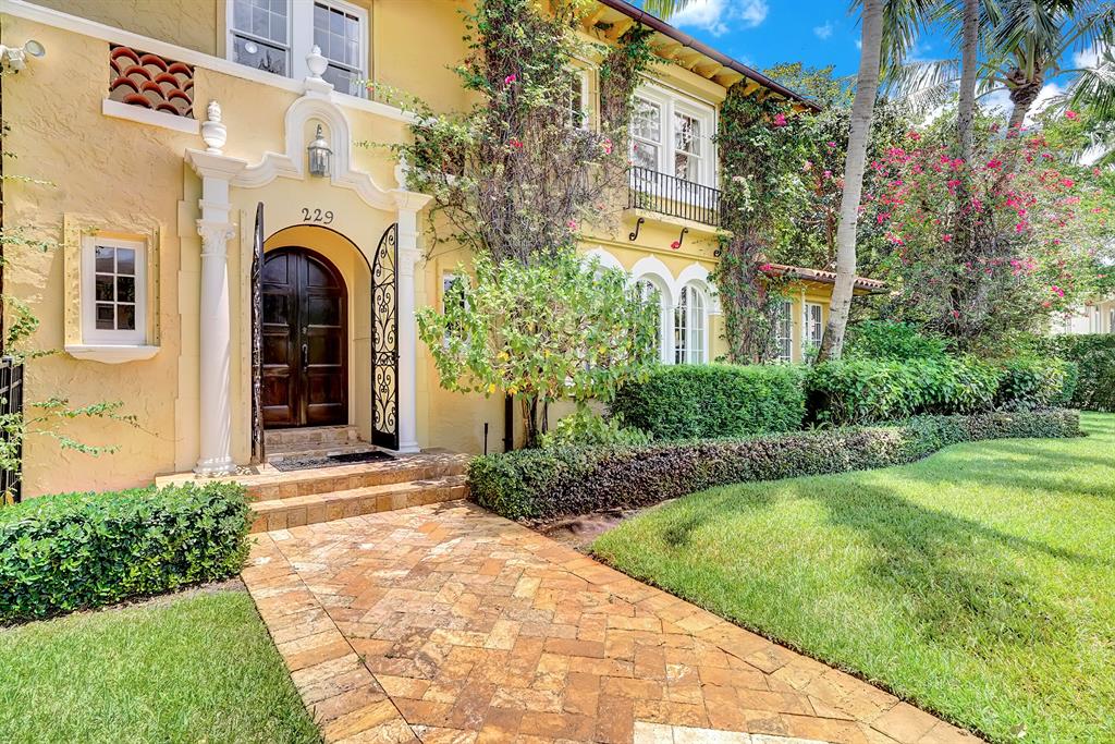 Designed by renowned American Architect William Manly King, this historic terracotta brick home with bonus apartment building is located just steps away from the intra-coastal and the nightlife found in Downtown West Palm Beach. This 1/3 acre property elegantly embraces a Mediterranean atmosphere, and has been maintained with a high attention to detail. 5 bedrooms total, 4 full baths, along with 2 powder rooms. Walking through the hardwood doors, a hand-painted mural has a scene coming to life, extended by the faux-marble columns in the main living room. Complete with a gas fireplace, over-sized crown molding, hardwood, marble and Spanish tile floors. Master bedroom is found upstairs beyond the grand, artisan staircase, and the master bath features a separate tub, shower and two vanities. The custom gourmet kitchen features Viking appliances, granite countertops, and matching finishes that completes the classic Palm Beach-styled breakfast nook. French doors provide lots of natural light, and leads to the tropical Oasis found on the back patio. Covered Lanai overlooking the pool embellishes the quiet, serene Florida landscape. Access available by the large mother in law suite downstairs. Mother in Law suite AND separate apartment appliances included!
BONUS 2008 separate apartment building is perfect for AIRBNB/ VRBO. One bedroom with full kitchen, two car garage, washer & dryer, and access to 3 balconies with French doors overlooking the pool. Legal rental, complete with its own mailing address and street entrance.
Owner has great attention to detail and meticulously maintained the grounds. Recent updates include copper gutters, refinishing of wood floors/ kitchen cabinets, and much more! Move in with your mind at ease knowing this property has been properly maintained, ready for a new owner!