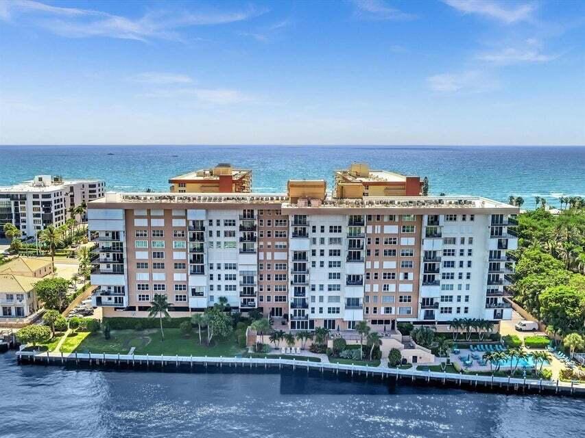 Move right into this meticulously maintained 4th floor condo right on the Intracoastal — there's nothing to do but bring your toothbrush. Enter through the recently updated & renovated lobby, with every floor of the building thoughtfully renovated to reflect pride of ownership throughout. Enjoy peaceful mornings and breathtaking sunsets from the spacious balcony, where endless water views create the perfect backdrop for relaxed coastal living. From this prime vantage point, you'll have front-row seats to the annual boat show (every December)  & year-round boating activity. Perfectly positioned at the point where the ocean & Intracoastal are closest to each other, this location truly offers the best of both worlds — easy & private beach access paired with dynamic waterfront views.     Relax by the heated Intracoastal pool complete with BBQ area, or simply walk across the street and put your toes on the sand! The kitchen features beautiful cabinetry with abundant storage, blending style and functionality. Whether preparing a quiet meal or entertaining guests, you'll appreciate the thoughtful layout and generous space. Newer oversized tile flows throughout the main living areas, while the bedrooms feature neutral, warm laminate flooring, creating a cohesive and inviting interior. All windows are hurricane impact for added peace of mind, and the newer A/C system ensures comfort and efficiency year-round. A convenient same-floor laundry and storage room adds to the ease of everyday living. The building has recently installed a new roof (2023), and the balconies are currently being updated, further enhancing the property's value and appeal. Water and Direct TV are included in monthly maintenance. Spoil yourself at numerous restaurants and shops just down the road. Endless views, refreshing sea breezes, and effortless coastal living await you.
