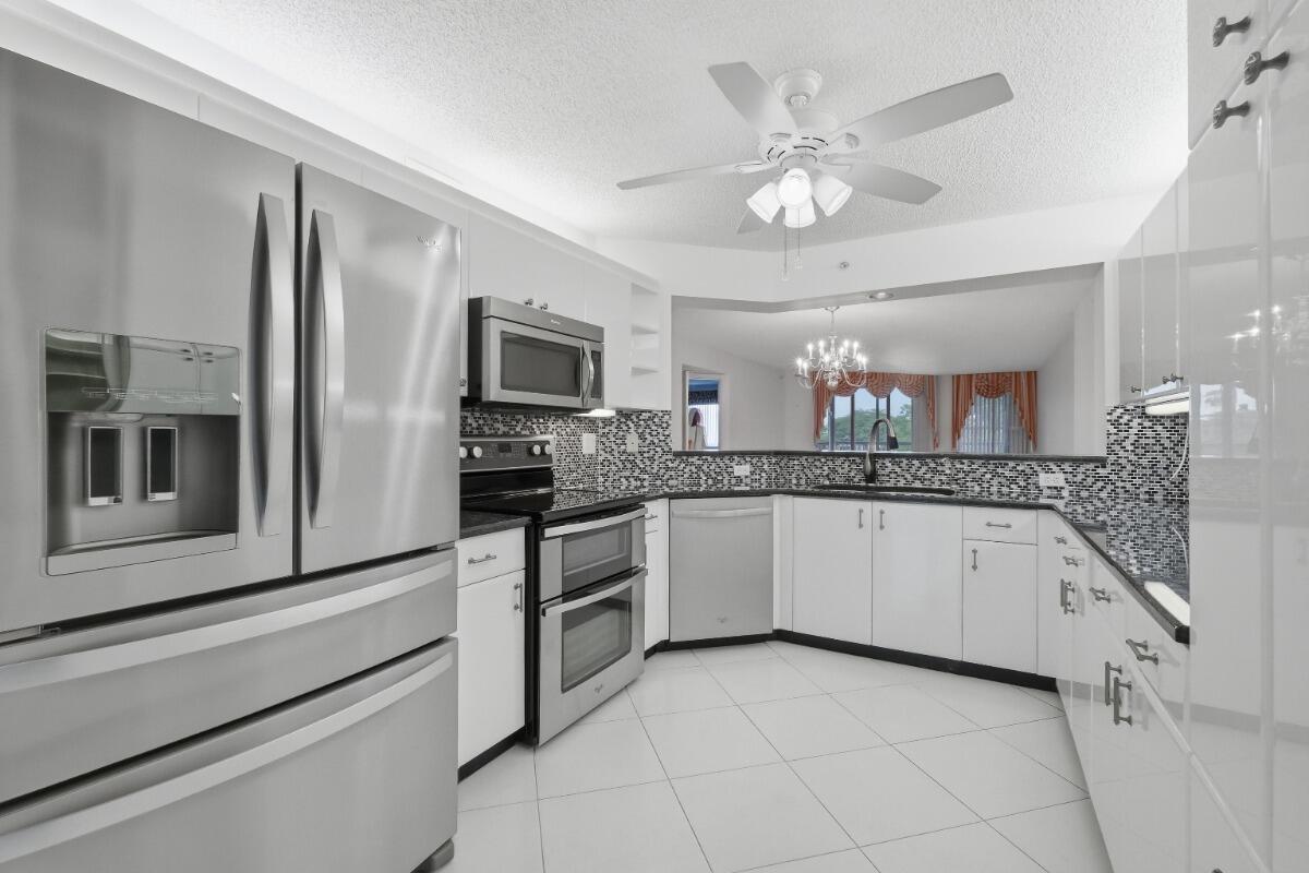 Welcome to this spacious and well-maintained 3-bedroom, 2-bathroom PLUS den, offering 1,772 sq ft of comfortable living space in the highly desirable double-gated 55+ community of King's Point. Perfectly positioned as a corner unit with beautiful lake views, this home features expansive front and back patios, creating the perfect setting for indoor-outdoor living. Inside, enjoy a bright and functional layout with granite countertops and recent upgrades, including a brand-new water heater (2026) with a 3-year warranty, a refrigerator (December 2025) with warranty included, and an in-unit washer and dryer. Experience the resort-style lifestyle at King's Point with amenities, social activities, maintained grounds, and convenient access to shopping, dining, healthcare, and major roadways.