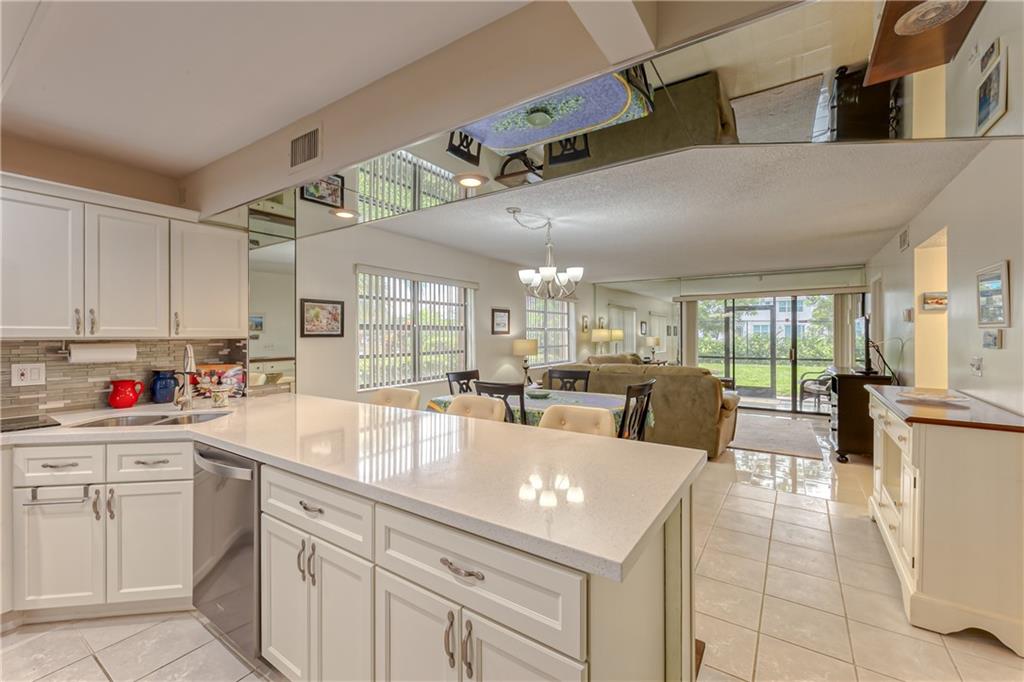 **GORGEOUS and RARELY AVAILABLE** First floor, Corner, 2 Bedroom, 3 Full Bathrooms, Furnished Condo, in the highly sought after Serenity Place III. Recently renovated with Quartz Countertops, Stainless Steel Appliances, Beautiful Cabinetry, New Tile, Washer/Dryer and Walk-In Pantry. The Unit features an Open Kitchen Floor plan with 2 Master Suites, Split Bedrooms, Walk-In Closets and spacious Screened Patio overlooking the Canal.  Conveniently located near I-95, Florida's Turnpike and the Sawgrass Expressway. Pets under 20#s allowed. Rentals allowed.