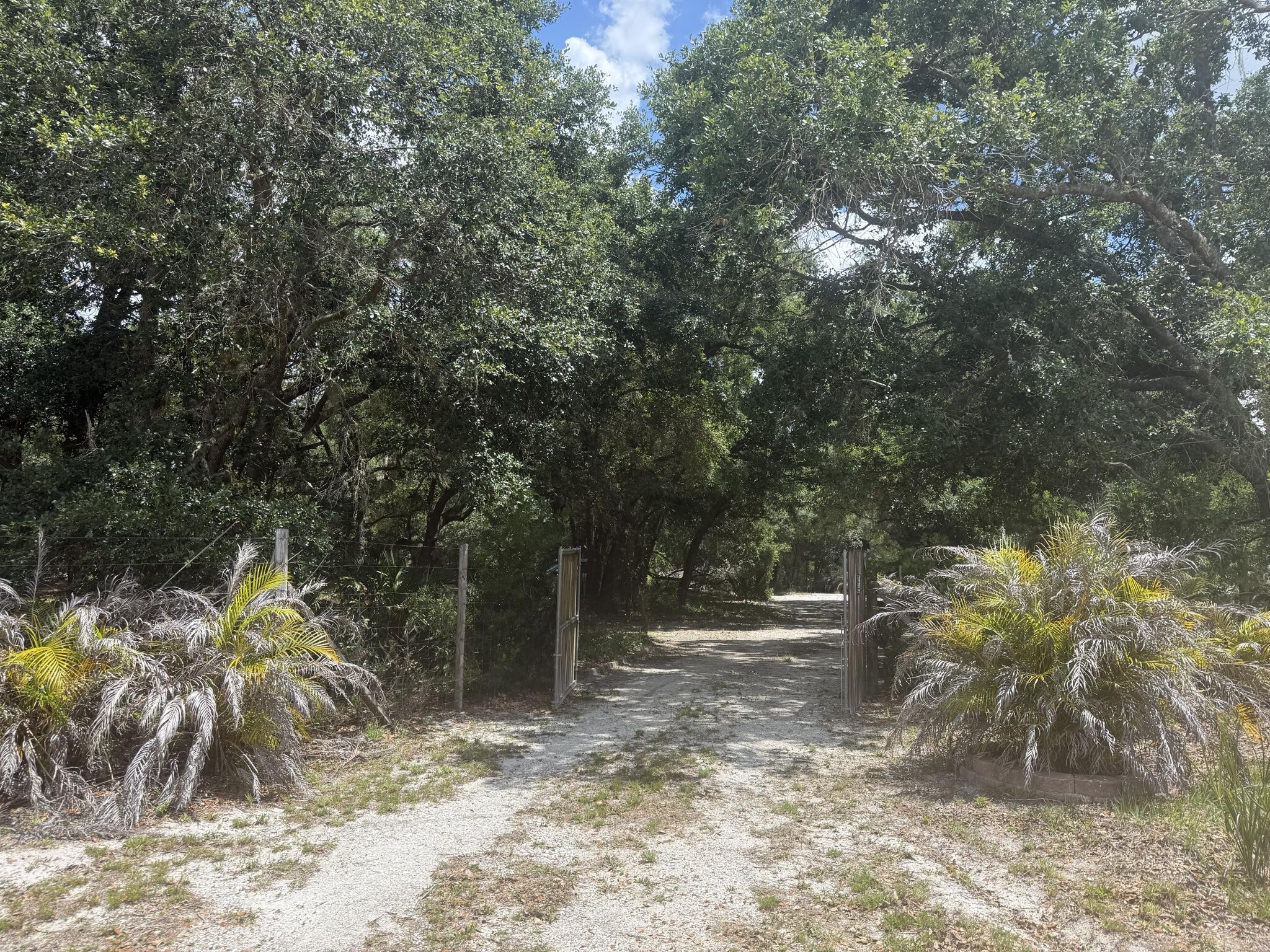Bring your vision to life on this beautiful 1.25-acre property located in a peaceful and private setting. This high and dry parcel is completely fenced and features a complete irrigation system throughout the property, making it ideal for gardening, farming, animals, or future improvements. Enjoy the convenience of a storage shed, plenty of parking space for vehicles, trailers, boats, or equipment, and power poles already located at the street for easy utility access. Property currently operates off generator power, offering flexibility. A great opportunity to own versatile acreage with endless potential! Buyer to perform all due diligence regarding zoning, land use, utilities, and building requirements.