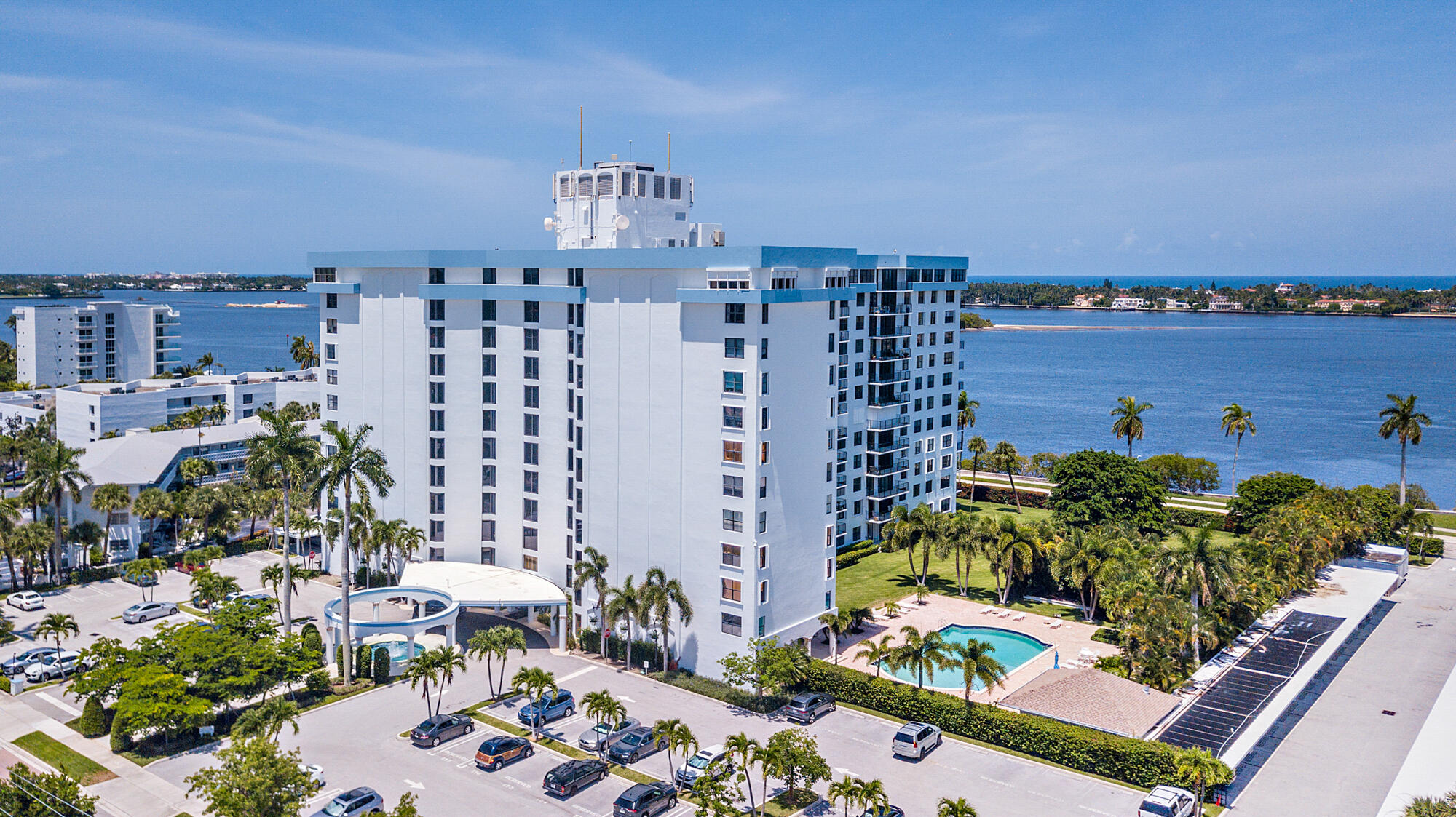 Experience breathtaking direct Intracoastal views from this stunning 9th-floor residence at 3800 Washington Road. Wake up every morning to sweeping vistas of the Intracoastal Waterway, Palm Beach Island, and the iconic Mar-a-Lago estate — all from the comfort of your own home. This spacious 3-bedroom, 2-bathroom residence is clean, bright, and completely turnkey — move-in ready and offering an effortless South Florida lifestyle. Flooded with natural light and thoughtfully maintained, every detail has been taken care of so you can simply arrive and enjoy. Residents enjoy an impressive array of building amenities including a heated pool, sauna, and direct lake trail access — perfect for morning walks or evening strolls along the water. Ideally situated just minutes from downtown West Palm Beach, Palm Beach Island, world-class dining, shopping, and PBI Airport, this is a rare opportunity to lease a generously sized 3-bedroom unit with one of the most coveted views in all of Palm Beach County. Available for annual lease. Properties with views like this don't stay available long.