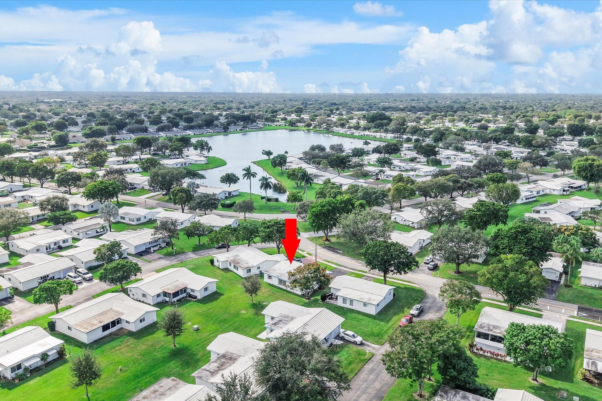 MUST SEE! LAWN CARE, EXTERIOR PAINTING & ROOF MAINTENANCE ARE COVERED! HOA Fees also cover Fiber Optic HDTV & Internet, Free community bus, expansive Clubhouse, 2 Pools, Tennis Courts, Pool Tables, Ping Pong, Card rooms, Hosted Events/Shows for your entertainment, & a Fitness Center. This 55+ community is well-maintained and close to shopping, golf, parks, and so much more. The home offers a screened-in patio, Florida room, and a newly renovated bathroom. This 2-bedroom home offers you the chance to have that South Florida lifestyle you've been searching for.