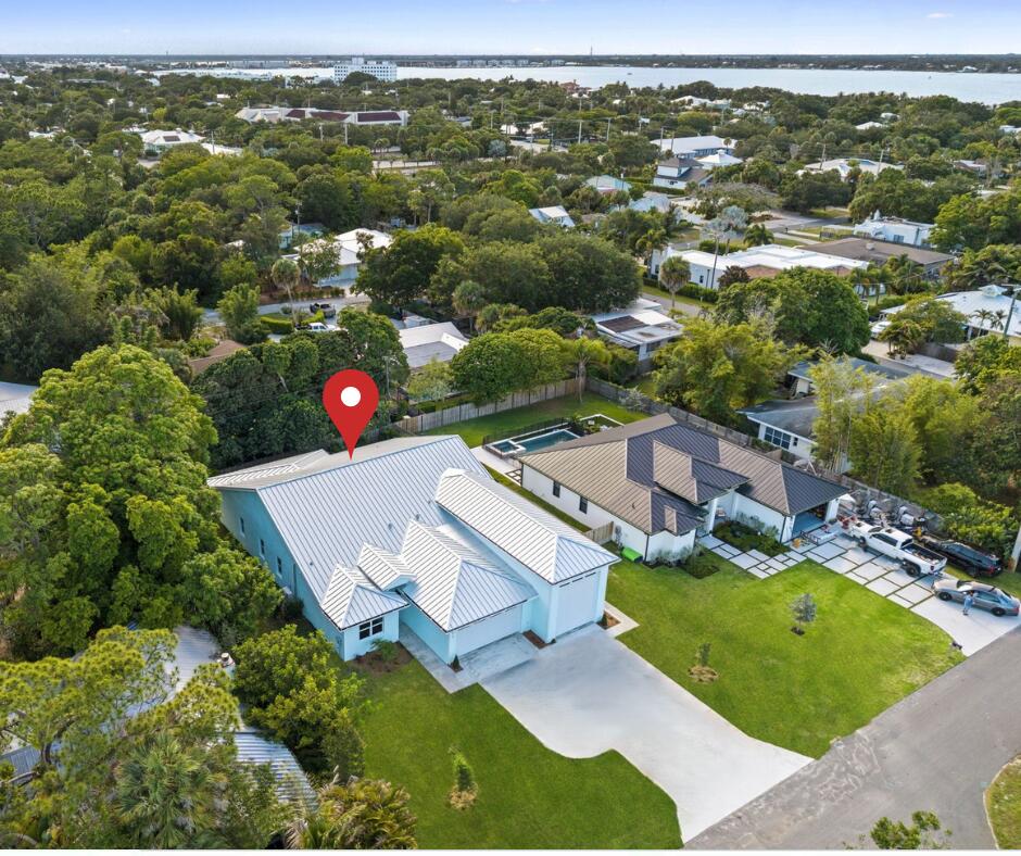 NEW 2026 CBS home with NO HOA! Stunning kitchen and baths! Split floor plan, open-concept design, volume ceilings, and a light, bright interior create an inviting living space. The air-conditioned RV garage features extra-strength concrete flooring, a full bathroom, plus dedicated washer & dryer, perfect for your RV, boat & trailer, jet skis, and all your recreational toys. Enjoy Florida living on the large, covered patio with a plumbed outdoor kitchen/grill area. The oversized backyard offers plenty of room for a pool. Ideally located just 10 minutes to Stuart Beach, a little over a mile from Historic Downtown Stuart's shops and dining, minutes to a public boat launch, and within walking distance of the Audubon of Martin County.