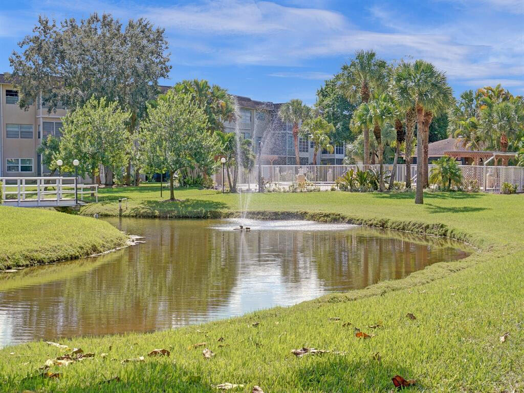 LAKEFRONT ESTATE SALE - PRICED TO SELL! Wake up to serene lake views from your bright enclosed Florida room in this desirable 55+ community. This 2BR/2BA ground-floor condo offers the perfect combination of convenience and resort-style living. Gleaming ceramic tile throughout, spacious layout with split bedrooms for privacy, and generous storage. The real value? $382/mo HOA covers heated pool, fitness center, clubhouse, elevator, AND all exterior maintenance - true turnkey living. Located in an elevator building with easy access to Turnpike, shopping, and Cleveland Clinic. Motivated seller, easy to show, won't last at this price! Schedule your showing today. You will fall in love with the community atmosphere which includes relaxing gardens, beautiful lakes, and social areas full of amenities to keep you busy. Whether you are looking for a seasonal retreat or a permanent home, this property offers the best of Florida living. Close to shopping, dining, and entertainment. Schedule your private showing today to see this gem in person. Please note: Some images have been virtually staged to better showcase the true potential of rooms and spaces in the home.