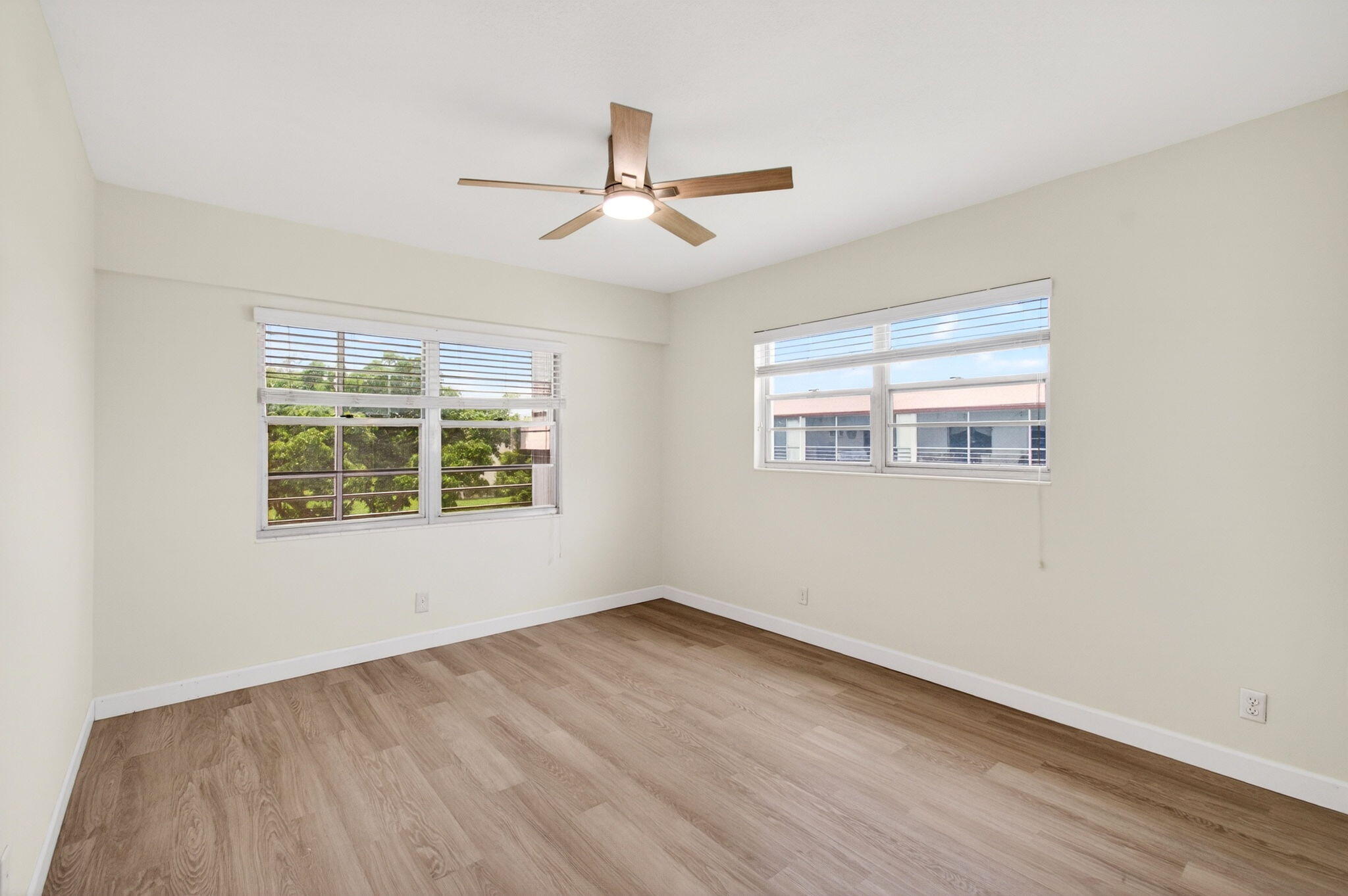 Located on the third and top floor with no neighbors above and serene garden views, this beautifully refreshed two-bedroom, one-and-a-half-bath residence in Brighton I at Century Village is turnkey and move-in ready. New bedroom and bathroom flooring, fresh paint throughout, and new ceiling fans. A private screened patio where your mornings begin quietly, above the treetops. HOA includes cable, internet, hot water, water, sewer, trash, pool service, pest control, exterior maintenance, roof repairs, building insurance, security, and reserve funds. Century Village offers pools, a grand clubhouse, tennis, a theater, a community shuttle, and houses of worship on site.