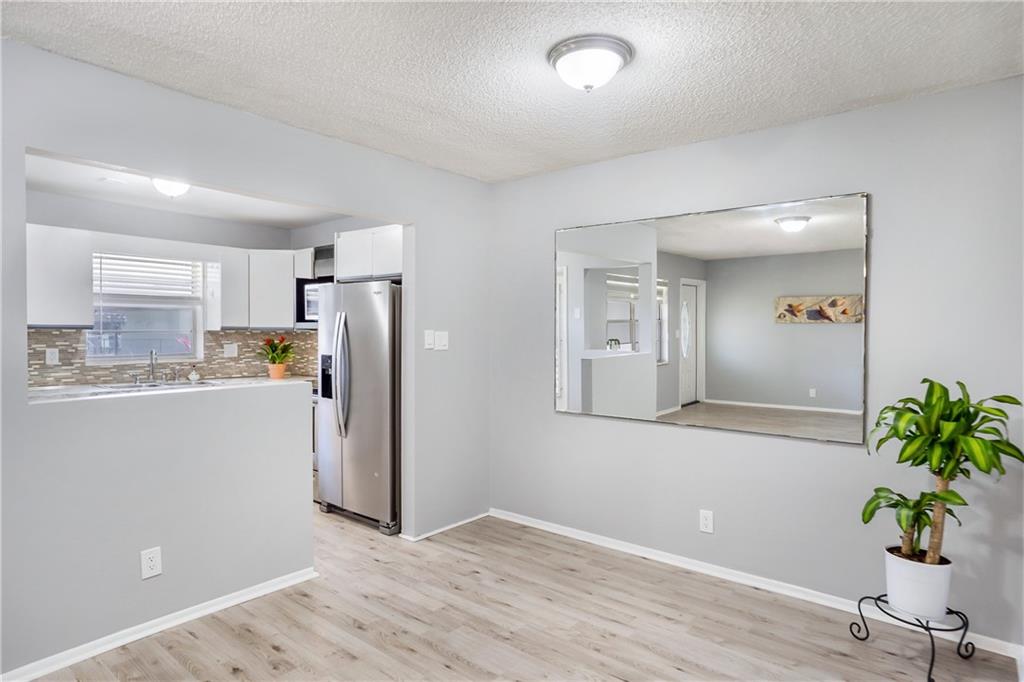 OWNER SAYS SELL!  CASH BUYER ONLY. ONE OF HOLLYWOOD'S ADULT GATED COMMUNITY.  A 2/2 first floor unit with large screened porch overlooking gardens and pool. ONE OF THE BEST LOCATIONS AND VIEW IN THE COMPLEX.  1 assigned parking space.  Great price for this 2/2 first floor condo.  Kitchen has stainless appliances, and  back-splash.  One bath has large step in shower. master has combo tub shower.  Laminate flooring Freshly painted. Central a/c.  Steps to  pool & picnic area.  One assigned parking space closest to entry.  Complex has 6 pools, community center with exercise room, and various activities.  10 minutes to 1-95 or the turnpike, minutes to shopping and entertainment. Laundry room elevator 2nd floor.  NO PETS.  Renting after 1 year of ownership. Maintenance in Jan will be $577. Two associations Monthly maintenance is paid to the master association monthly and one time a year payment to building D.  50 year inspections were done waiting on repair estimates with budgets.