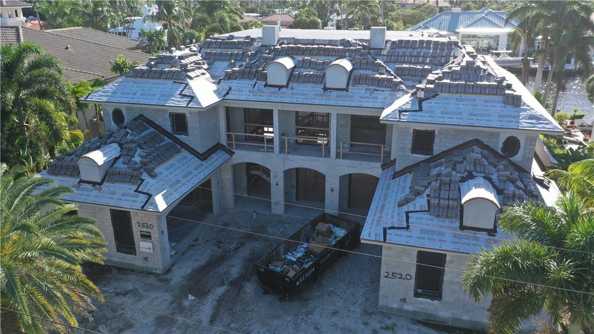 New construction British West Indies Palatial Estate.  105 feet of waterfront on one of the widest, deepest canals in Harbor Beach.  Over 8000 square feet of air conditioned living area featuring a showpiece kitchen that would humble a world class chef.  The Great room and Clubroom share a duel sided gas fireplace and are designed ideally for entertaining. Additional first floor features include, wine room, wet bar, elevator, library, laundry and maids quarters. Second floor features five ensuite bedrooms including  the master suite with separate his and hers baths and closets, a second floor laundry and additional entertaining space with large balcony overlooking the pool.  Other features-Infinity edge pool, summer kitchen, generator, new seawall, new concrete dock, oversize 4-car garage.