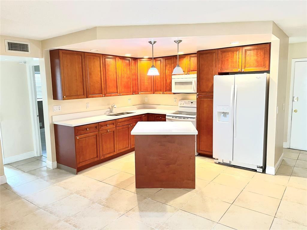 Welcome to this charming three-bedroom, two-bathroom condominium in Arbor Keys Condo, located in Tamarac, Florida. This two-story residence offers 1,167 square feet of finished living space, providing comfortable accommodations for various living arrangements. The well-proportioned layout spans multiple levels, allowing for distinct separation of living and sleeping areas. Situated within the established Arbor Keys community, this condo presents an accessible residential option in the Tamarac area. This property invites you to explore what it has to offer as part of your real estate search.