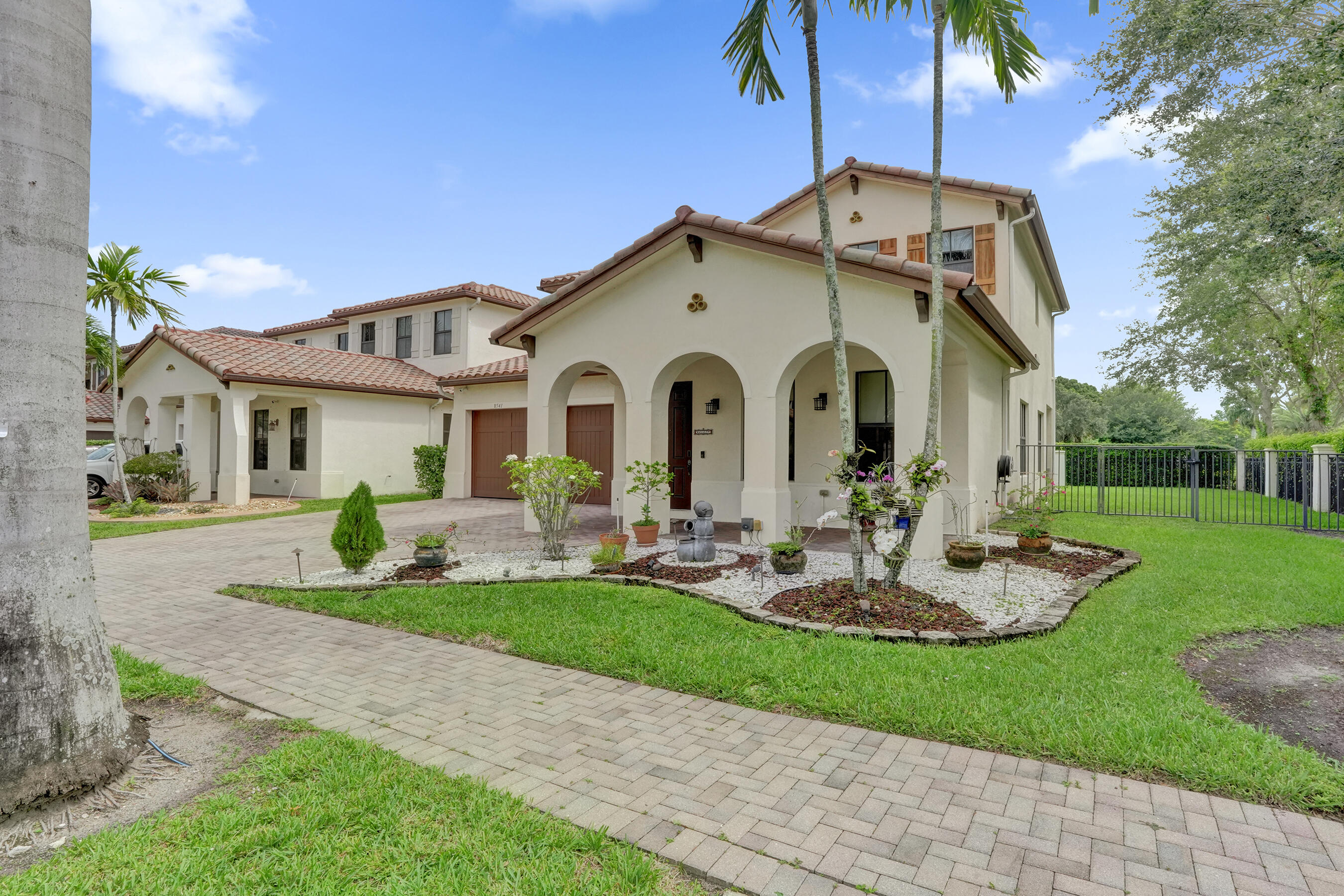 Let's be honest, corner lots are the extroverts of real estate and this one fully leans into it.  This Monterra Cooper City home is 4 bed, 3 bath and comes with the kind of update list that makes you wonder if the previous owner was secretly a contractor.  Full impact windows and doors throughout? Done. Professionally designed landscaping with a water fountain, front and back yard lighting, and a 240V outlet already wired for EV charging? Yes, really.  Inside, the open layout gives everyone room to spread out and find their spot. The kitchen with under cabinet lighting is the kind of space where morning coffee turns into a longer conversation  than you planned. Tile and laminate flooring runs throughout, custom oversized closets keep everything in its place, and an upgraded staircase with modern railings adds a detail that just feels right. Two living areas give you the flexibility to use the space however your life actually works, whether that is a playroom, a home office, or a proper place to finally host without apologizing for the mess. Monterra does the community thing right. The clubhouse is literally across the street, bringing the resort style pool, tennis and basketball courts, gym, and parks within a two minute walk. Cooper City's A-rated schools are close by, and so is everything else you actually need. Someone already did all the work. All you have to do is show up and take the credit.