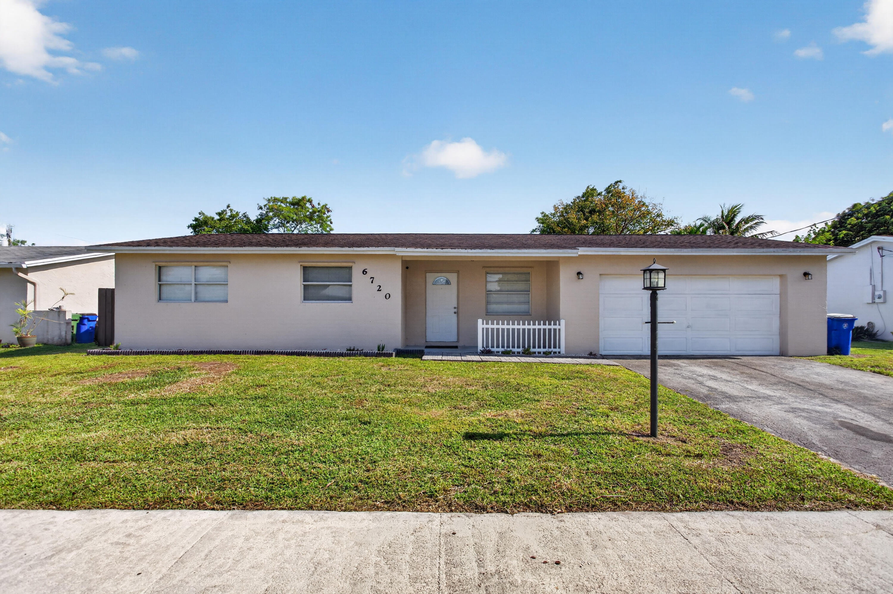 Tucked in a quiet Margate cul-de-sac, this NO HOA 3BR/2BA CBS home features a 2019 roof, 2-car garage and massive PET FRIENDLY fully fenced backyard with room for a pool. Featuring 1600 sq. ft. this single-story has an open floorplan to maximize space and the sizeable living area is versatile serving as a flex space for a kid's play area, game room or however you want to customize and make it yours! It flows into the eat-in kitchen and has tile/vinyl flooring throughout. Its new tankless water heater and newer roof make this home very energy efficient!  It has central AC throughout and a freshly painted exterior. Perfectly situated for an active lifestyle, just a short stroll to Firefighters Park's with lighted pickleball, tennis courts & basketball courts, a dog park, and walking trails.