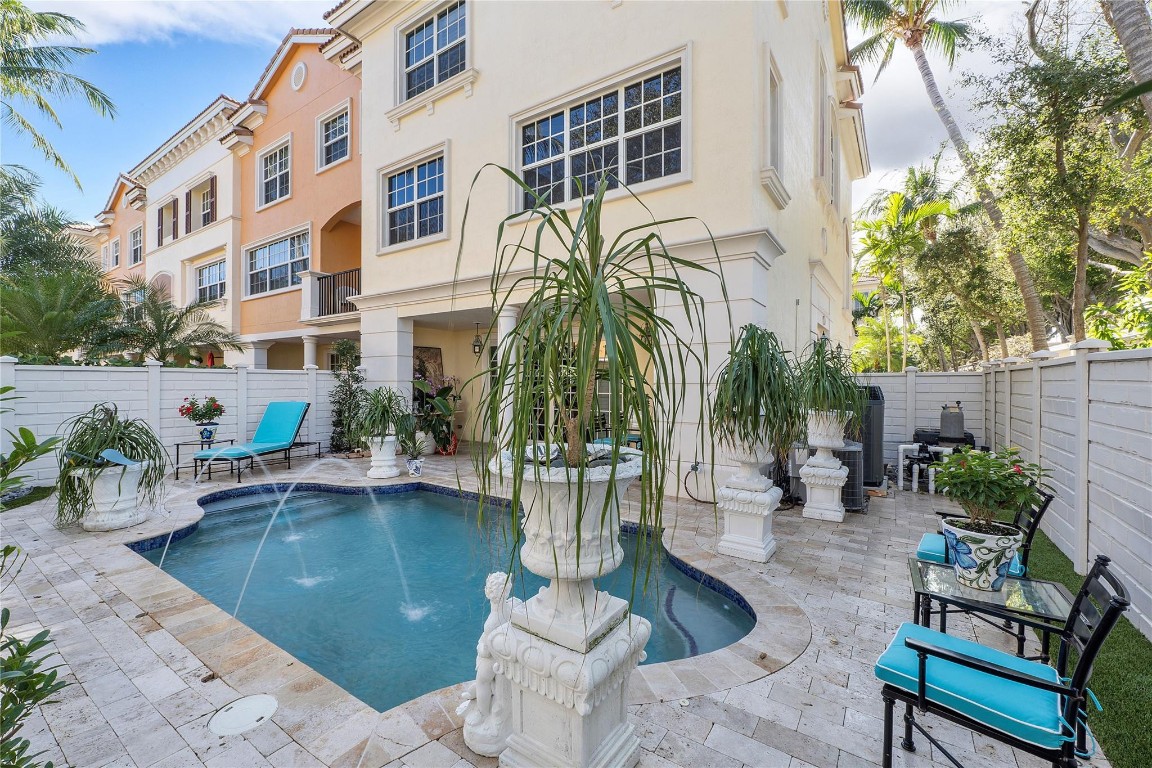 Beautifully renovated East Boca townhouse with elevator. Corner unit. Minutes to the beach, Mizner Park, and Atlantic Ave. 24 hour guard gated community. Impact windows. Office/option to make 4th bedroom. True pride of ownership. Tastefully upgraded throughout with built-ins and more. This is also the the only home in the development offering its own private heated pool. What a place to call home, with over 3,000 sqft of living space, along with outdoor patio space and a two-car garage.