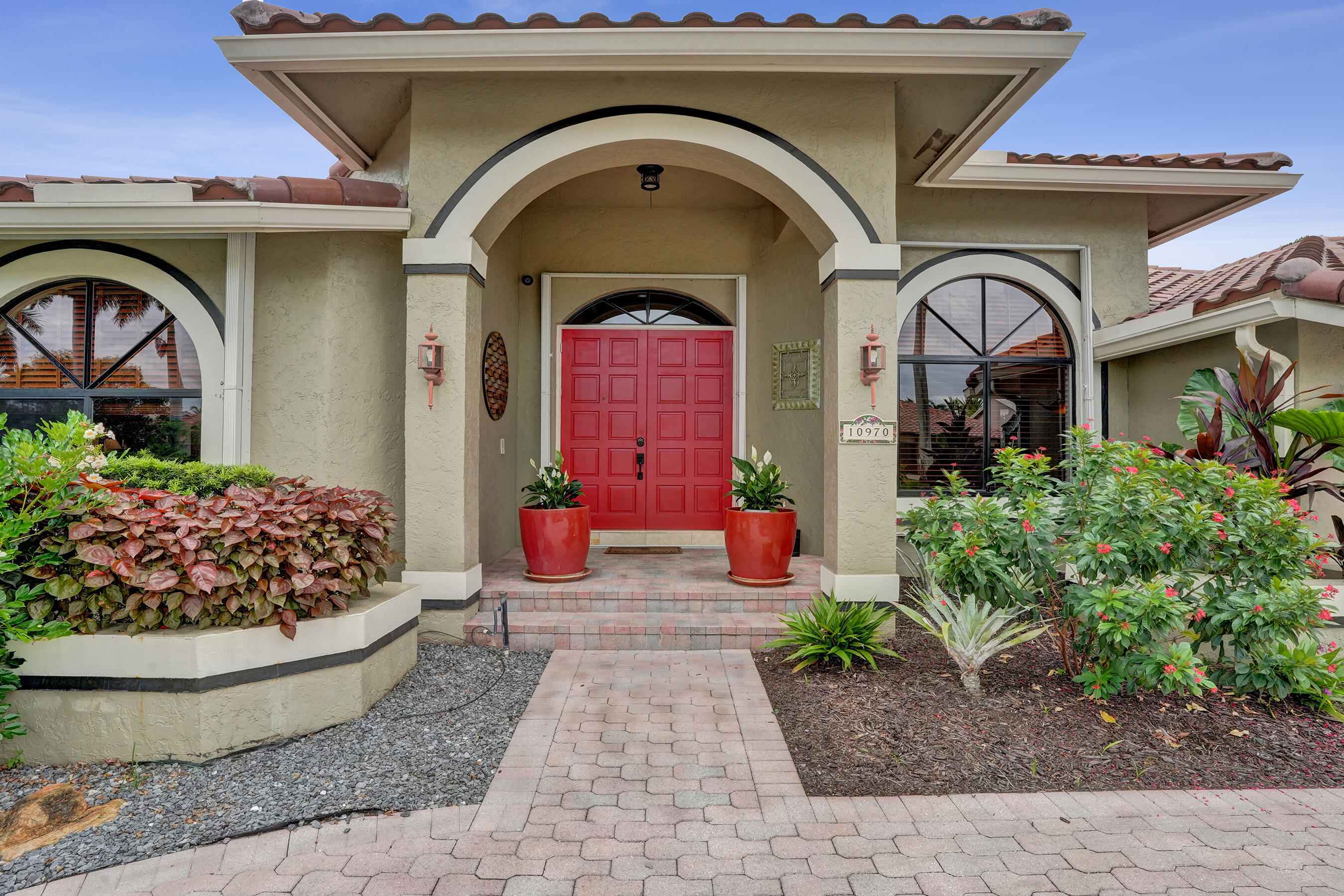 WOW! Live the Plantation waterfront lifestyle in this impeccably maintained 4-bedroom, 3.5-bath pool home with a split floorplan, 3-car garage, low HOA, and $200K in improvements! 2022 Roof. Screened patio, resurfaced heated pool/spa, peaceful water views surrounded by lush landscaping. Updated kitchen shines with SS appliances, a new refrigerator, granite countertops, 42" cabinets, soft-close drawers/cabinets, breakfast counter, breakfast nook, wet bar. Tons of storage. Interior features: polished marble floors, tile, plantation shutters, office built-ins, dedicated dining room, sizeable laundry room. Spacious primary bedroom offers two walk-in closets/custom cabinets. Top-rated schools, close to shops, dining, highways, houses of worship.