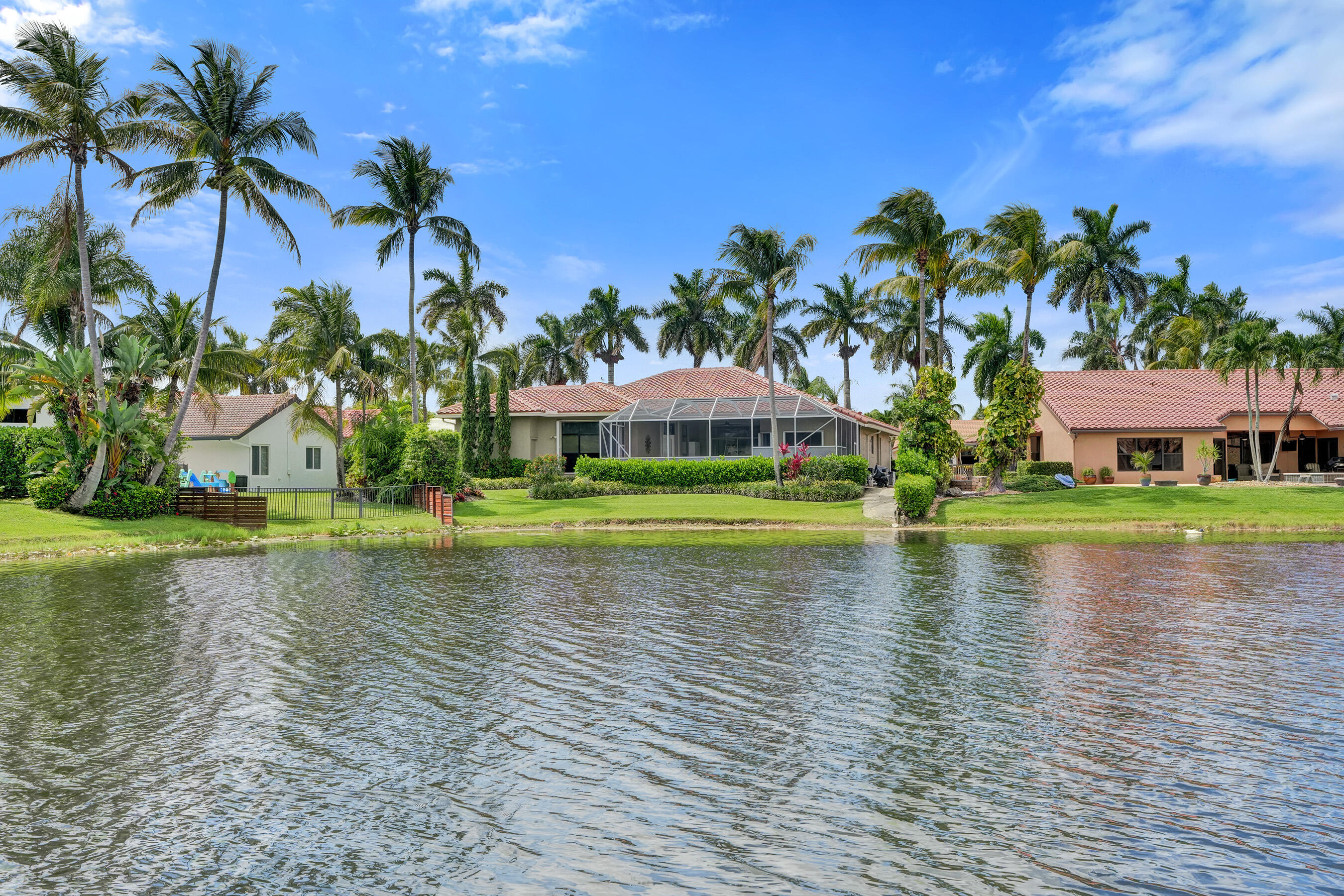 WOW! Live the Plantation waterfront lifestyle in this impeccably maintained 4-bedroom, 3.5-bath pool home with a split floorplan, 3-car garage, low HOA, and $200K in improvements! 2022 Roof. Screened patio, enjoy the resurfaced pool, and soak in peaceful water views surrounded by lush landscaping. The updated kitchen shines with stainless steel appliances, a new refrigerator coming, granite countertops, 42" cabinets, soft-close drawers and cabinets, breakfast counter, breakfast nook, bar area, and tons of storage. Interior features include polished marble floors, tile, wood flooring, plantation shutters, office built-ins, dedicated dining room, and sizeable laundry room. The spacious primary bedroom offers two walk-in closets/custom cabinetry. Enjoy access to top-rated schools,