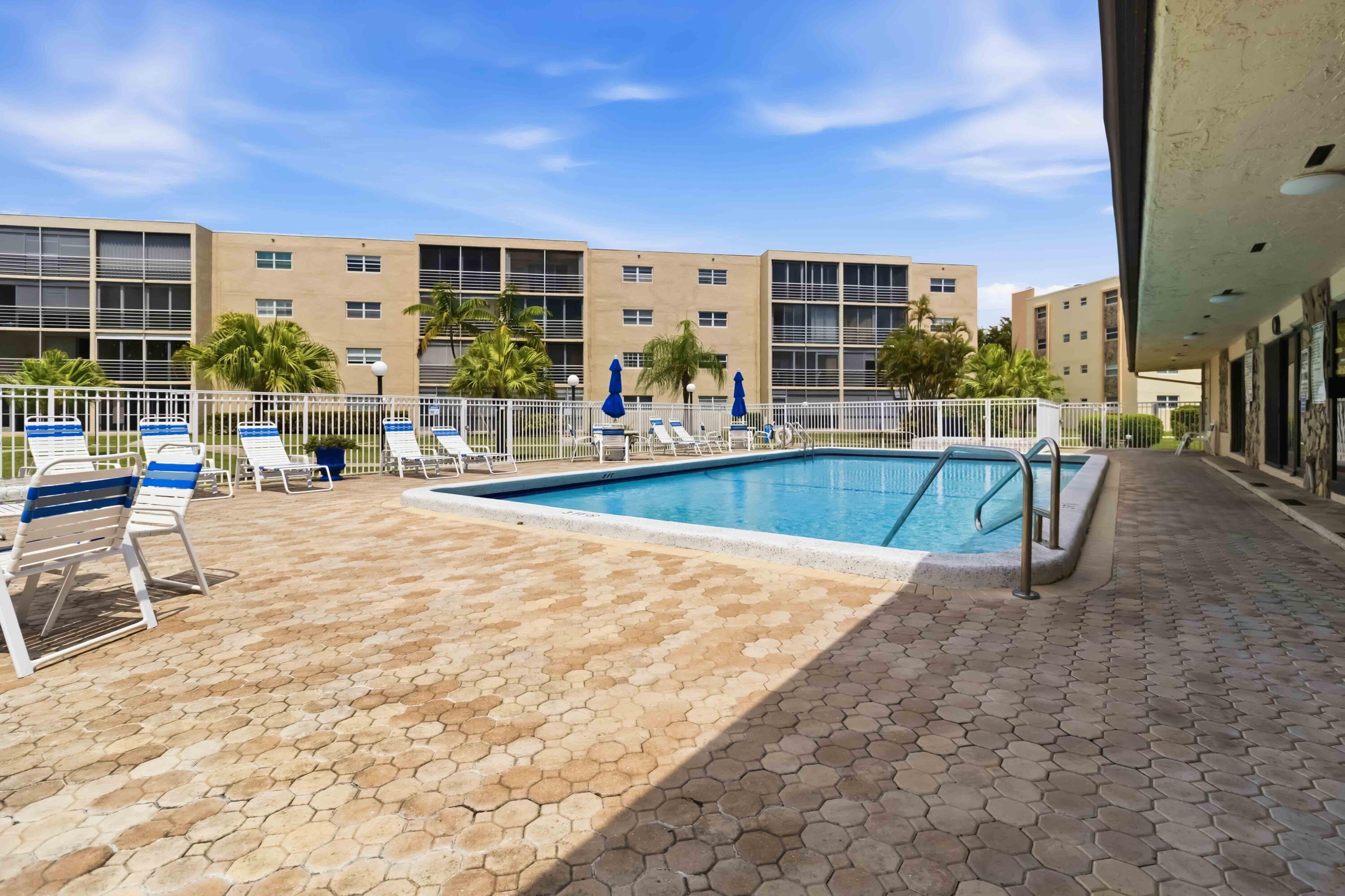 Fully furnished 2/2 condo on the 1st floor. Perfect opportunity to make this one your own. Living room opens to a covered patio overlooking the lake, amazing views of the sunset! One updated bathroom in the primary. Tiled floors throughout. Washer included in the unit, first floors only! Roof updated in 2024, building repainted in 2025