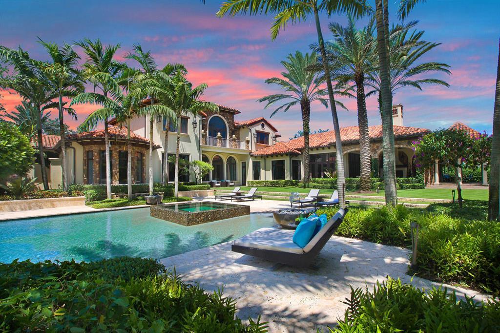 ONLY DOUBLE LOT FOR SALE...Your own private resort awaits you at this grand estate in prestigious Old Palm Golf Club.  Situated on over 2 acres, the spectacular outdoor space has a feeling of being in a hideaway resort with an oversized pool, summer kitchen and swim up bar, perfectly placed cabanas and lounge areas, a har-tru tennis court, private guest house and stunning golf and lake views.  This extraordinary home has 6 bedrooms and  7.2  bathrooms all with the finest finishes.   A Gourmet kitchen with a butlers pantry, club/ theater room with the latest technology,  an office with exquisite wood finishes and fireplace. The home is a perfect combination of timeless formal and casual living. The lavish master suite features his and her bathrooms, boutique style closets, morning bar, sitting area and an outdoor spa shower.  5 and half garage, elevator, generator, wine room, and much more! 12227 Tillinghast is a showpiece that will stand the test of time!
