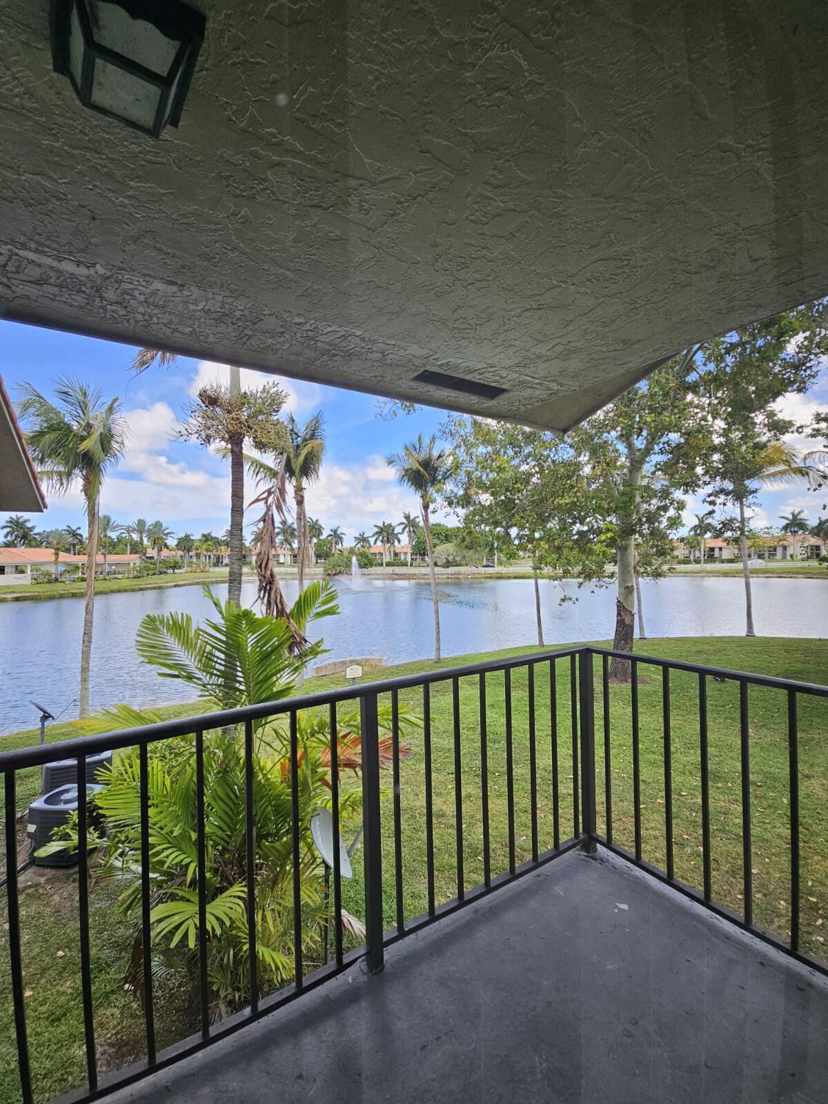 Discover this beautifully maintained, freshly painted, and renovated 2-bedroom, 2-bathroom condo with breathtaking lake views. The unit features elegant tile flooring in the living room and cozy laminate flooring in the bedrooms, offering both style and comfort.  The modern kitchen is equipped with brand-new stainless steel appliances, perfect for any culinary enthusiast. Decorative ceiling fans add a stylish touch throughout the home. Enjoy the convenience of a brand-new in-unit washer and dryer.  Relax on your private balcony while taking in the serene lake views. Located just minutes from the Florida Turnpike, major roads, shopping centers, dining, and entertainment, this property offers easy access to everything West Palm Beach has to offer