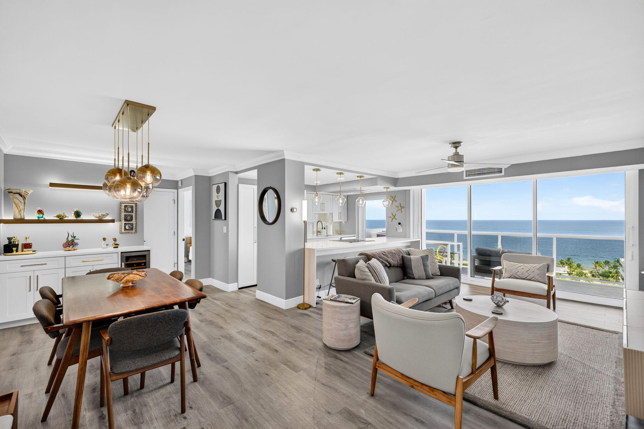 Panoramic unobstructed ocean views from every room. Beautifully renovated 2-bed 2-bath residence at Vantage View. Open split floor plan with floor to ceiling windows and doors that open up to one of the building's largest balconies perched over the ocean. Inside, a chef's kitchen with quartz countertops and stainless steal appliances, premium lighting, bar with wine fridge, spacious bedrooms, renovated bathrooms, electric shades, brand new AC, and modern finishes throughout. Offered turn-key fully furnished. Residents enjoy a rooftop pool, fitness center, sauna, 24-hour security, and an unbeatable location just steps from Fort Lauderdale Beach, dining, and shopping. Current assessments all paid off!