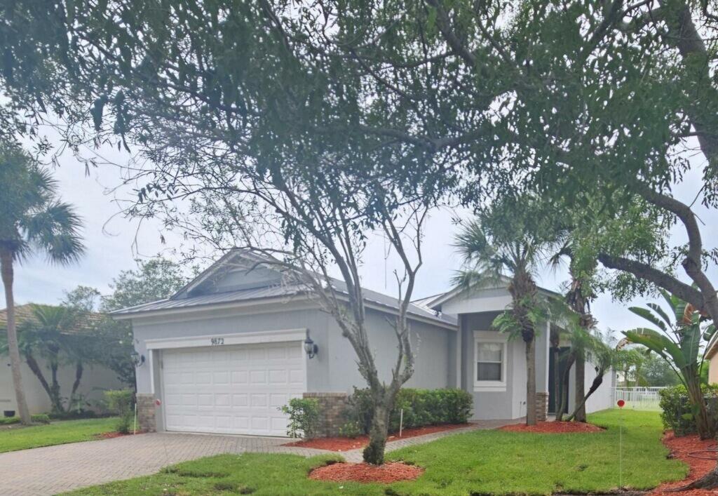 ALL AGE COMMUNITY! Freshly PAINTED INTERIOR & NEW DOORS! Summertime is here, come relocate to Heritage Oaks in Traditions with A+ SCHOOLS! 3/2/2 W/ LAKE VIEWS & A WIDE OPEN GREENSPACE DIRECTLY BEHIND HOME! 2023 METAL ROOF!  Volume Ceilings & Split Floorplan. Large Covered patio with extended pavers and White Aluminum Fence. Main Bedroom includes Lake View, Walk-in Closet & large Main Bathroom. Inside Laundry. Tiled in main living areas, Laminate flooring in bedrooms (no carpet). Ceiling Fans throughout. Walk across street to Pool & Clubhouse. Eat-in Kitchen. Gated Community with low HOA- $458 INCLUDES: CABLE, INTERNET, ALARM, LAWN, FERTILIZATION, SPRINKLER OFF LAKE, PEST CONTROL, GUARD GATE, GYM, POOL/CLUBHOUSE. Close to shopping, restaurants, parks & EVENTS THROUGHOUT THE YEAR!