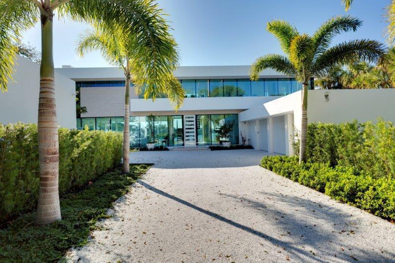 Ultra Modern Point Estate. On over half acre with 315' of total water frontage on 2 sides with boat lift, this cutting edge home in a private setting offers spectacular southern water views from every room. 6,000lb boat lift on east side of property, provision installed for a whole house generator, 3 car attached garage, guest house with separate entrance & kitchen The information provided including but not limited to prices, measurements, square footages, lot sizes, calculations have been obtained and conveyed from third parties. All information including that produced by the Sellers or Listing Company are subject to errors, omissions or changes without notice and should be independently verified.  The Sellers and Listing Company expressly disclaim any warranty or representation regarding all information.  Prospective purchasers' use of this or any written and information is acknowledgement of this disclaimer and that Prospects shall perform their own due diligence.  Prospective purchasers shall not rely on any written information provided when entering a contract for sale and purchase.  In the event a Buyer defaults, no commission will be paid to either Broker on the Deposits retained by the Seller. No Commissions Paid until Title Passes.