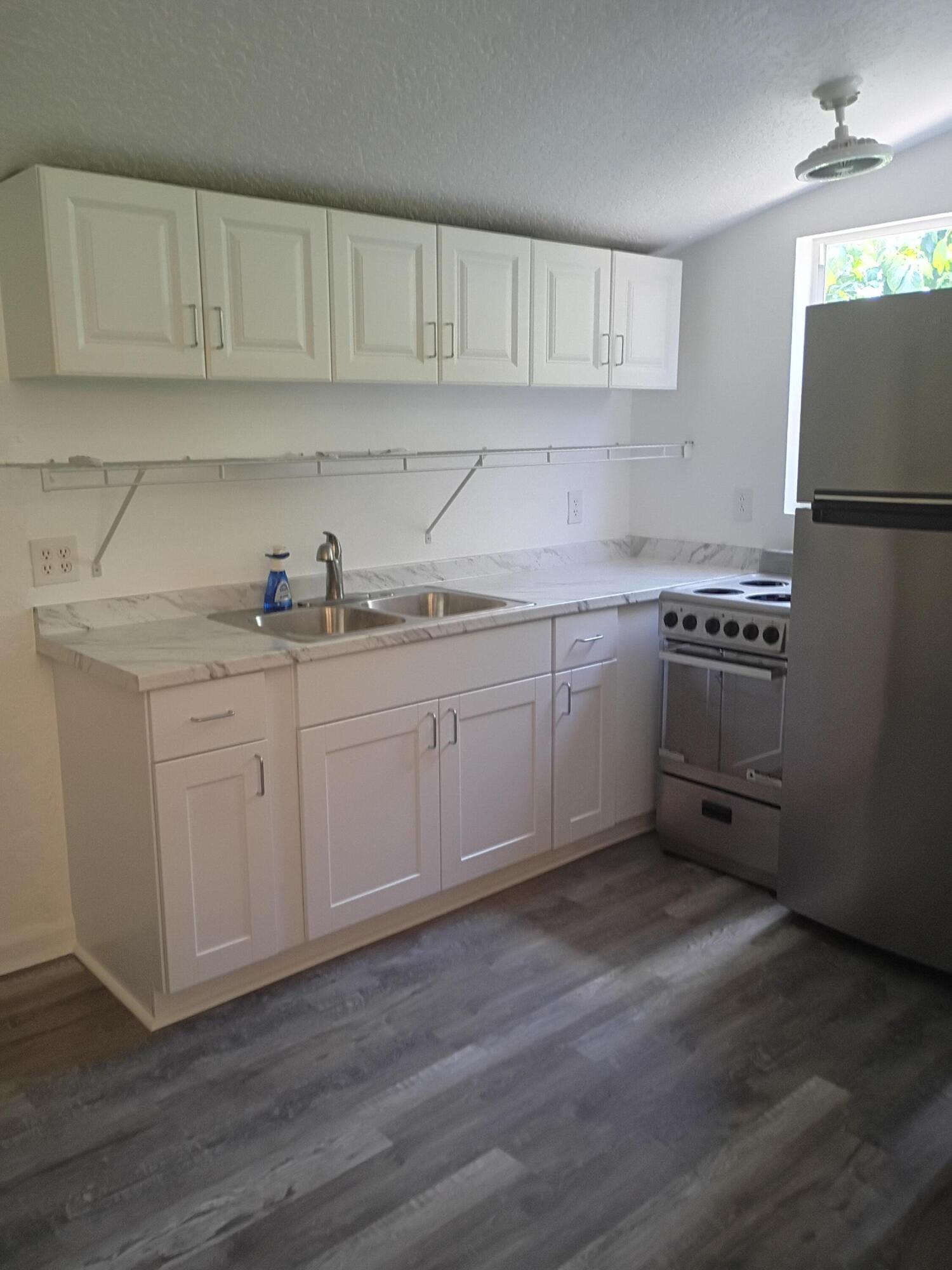 Beautifully redone detached studio. New flooring, paint, kitchen cabinets and new shower. Nice yard. Partially fenced. Water and lawn care is included.