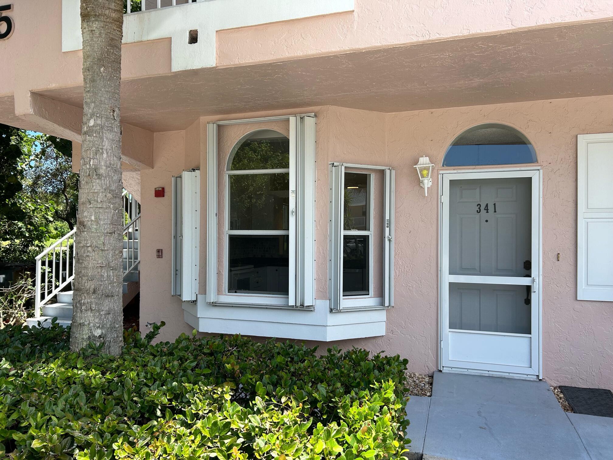 Welcome to this beautifully updated first-floor corner condo located in the highly desirable Little Club community in Tequesta/Jupiter. This light and bright residence features 2 split bedrooms and 2 bathrooms, offering ideal privacy for guests and comfortable everyday living. Step inside to discover tall ceilings and brand-new flooring throughout, creating an open & airy feel. The spacious layout also includes a convenient in-unit washer and dryer—an uncommon and valuable feature in this community. The ground-floor corner location provides easy access with no stairs and added natural light. Enjoy peaceful mornings and relaxing evenings overlooking the lush golf course from your private patio. Residents of Little Club enjoy a wide array of amenities, including an active  clubhouse, heated pool, tennis courts, pickleball, bocce ball, library, game room, and a vibrant social calendar. The community is known for its serene setting and welcoming atmosphere.  Don't miss this opportunity to own a move-in-ready condo in a prime location close to beaches, dining, shopping, and everything Jupiter has to offer.