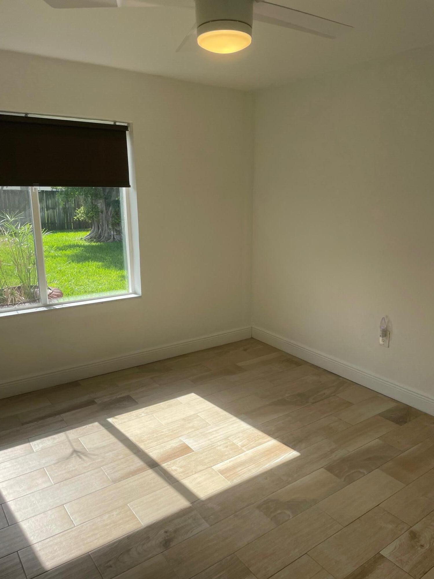 Beautifully light and bright freshly painted and updated 1BD/1BA in a duplex located minutes from Wilton Manors and Fort Lauderdale Beach. This modern residence features a custom kitchen with stainless steel appliances, granite countertops, newer A/C, impact windows, faux-wood tile flooring, and a spacious walk-in closet. The bathroom offers a spa like walk-in shower with river-rock flooring. Enjoy a large, fully fenced backyard—ideal for dog lovers—plus off-street parking. Water, sewer, and trash included in rent. Quick approval process. Unfurnished and ready for immediate move-in. Close to restaurants, nightlife, shops, parks, airport and the beach. A rare opportunity to enjoy comfort, style, and an unbeatable location!