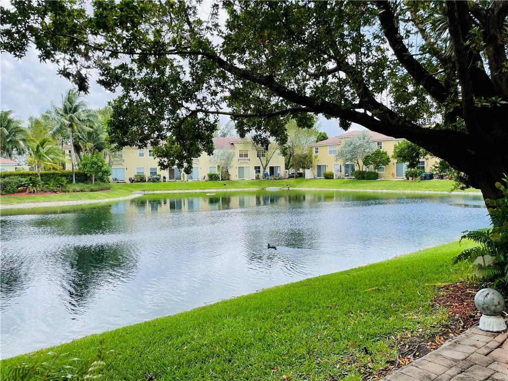 Waterfront Townhouse inside of Gated, Pet Friendly, Tuscan Villas! Community maintained Tropical landscaping surrounds you with while you enjoy the peaceful Lake View from your back patio. This 3 Bedroom and 2.5 bathrooms upgraded townhouse has it all! Featuring Hurricane Impact Windows throughout, Stainless Steel Appliances, Vinyl Wood-look Flooring upstairs, Full Size Washer and Dryer, Walk-In Closets, and Community Pool overlooking the Lake. Located in close proximity to Winn-Dixie and Publix, Banking, Gas, Shopping Centers, both I-95 and Turnpike, and other local attractions. Easy to view!